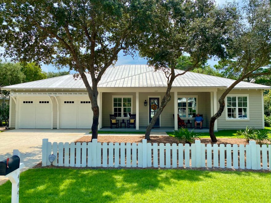 Located in the lovely neighborhood of SEABREEZE, this large lot home is the perfect balance of beach & traditional living. Every attention to detail has been given to this 2,800 SqFt home-including the outdoor living space! From the SCREENED HEATED POOL, PERSONAL PUTTING GREEN, HUGE fenced yard & 65'' outdoor TV & outdoor kitchen. Enter through the foyer w/ dining room & office on either side, into the huge GREAT ROOM w/ sliders leading to the outdoor living space. This home has 2 bedrooms w/ shared full bath, a separate private guest suite with bath, and GREAT MASTER SUITE w/ luxurious bath & WALK-IN CLOSETS! A 2 car GARAGE HAS A SEPARATE CONDITIONED ROOM for additional  space.  Behind the lanai lies 4 Raised Planter Beds and a patio lounge area w/ fire-pit. NO SHORT TERM RENTALS HERE