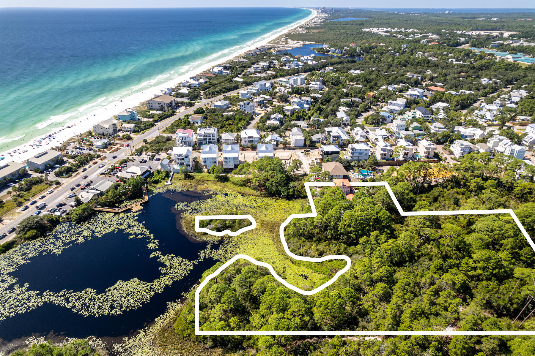 Introducing a remarkable investment opportunity in the heart of Dune Allen Beach! This expansive 5.5-acre parcel presents a rare canvas for creative development, with neighborhood infill zoning. Situated along the tranquil shores of Allen Lake, supplying a picturesque backdrop for potential homesites. Benefiting from its coveted location, this property offers proximity to pristine beaches, upscale amenities, and the vibrant coastal lifestyle that 30A is known for. The versatility of this land is unparalleled, offering the potential to construct multiple waterfront and non-waterfront residences, ranging from 2 to 8 homes per acre (more info can be provided). With the ability to subdivide the land, investors have the opportunity to tap into the growing demand for premium real estate in the  area. The property also includes a three story home with pool. The property is graced by natural wetlands, adding an extra layer of environmental significance. Mitigation is required to preserve this valuable ecosystem to allow for thoughtful development. Rarely does a parcel of this size, location, and zoning become available, making this an extraordinary chance for visionary developers. 