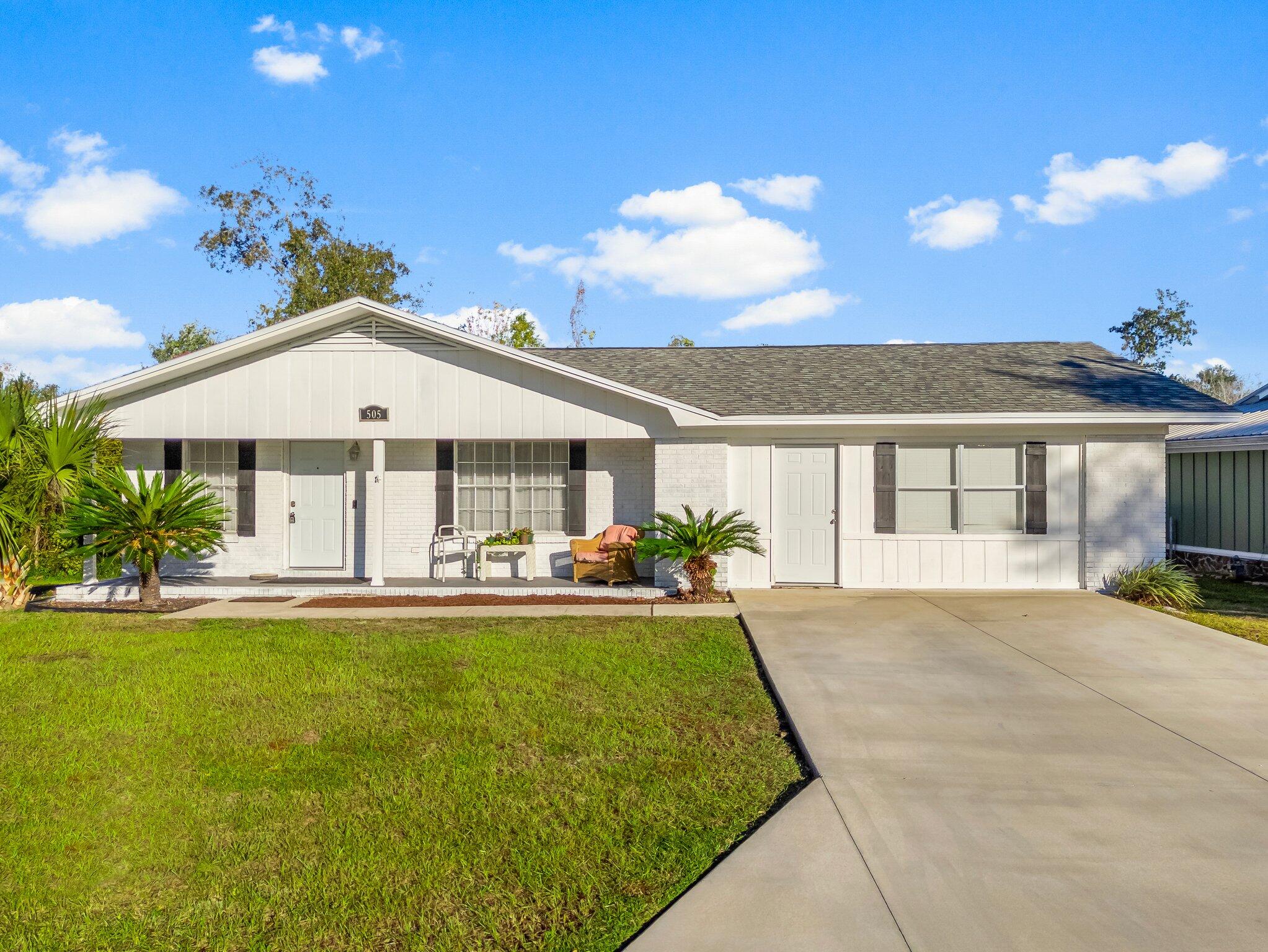 CURRENTLY UNDER CONTRACT, SELLER WILL CONSIDER BACKUP OFFERS' Discover the charm of this beautifully renovated 4-bedroom, 2-bathroom white brick home, perfectly situated in a serene neighborhood with picturesque oak trees and a water view of the creek. With no HOA and no flood insurance required by lenders, this home offers a rare combination of tranquillity and convenience. This home is also located about 7.4 miles to Tyndall AFB, 13 Miles to Panama city Beach and only 25 Miles to the international air Port. Inside, you'll find luxury vinyl plank flooring throughout, complementing the fresh and modern design. The inviting living room features a wood-burning fireplace, perfect for cozy evenings. The eat-in dining area connects seamlessly to the U-shaped kitche.