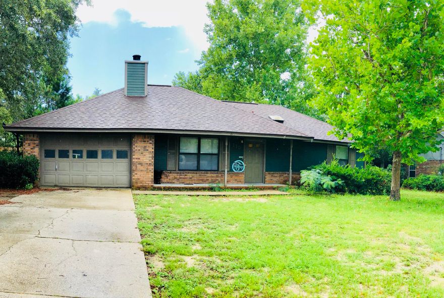 Excellent and affordable home located in the SOUTH end of Crestview. NEW DIMENSIONAL SHINGLE ROOF in 2017. This home has the features anyone would desire in a home: an oversized one car garage, large screened porch, open deck for entertaining, 3 bedrooms and 2 full baths, walk-in closets, wood burning fireplace, large tiled kitchen with pantry and a wonderful fenced in back yard. Call today for your private appointment.