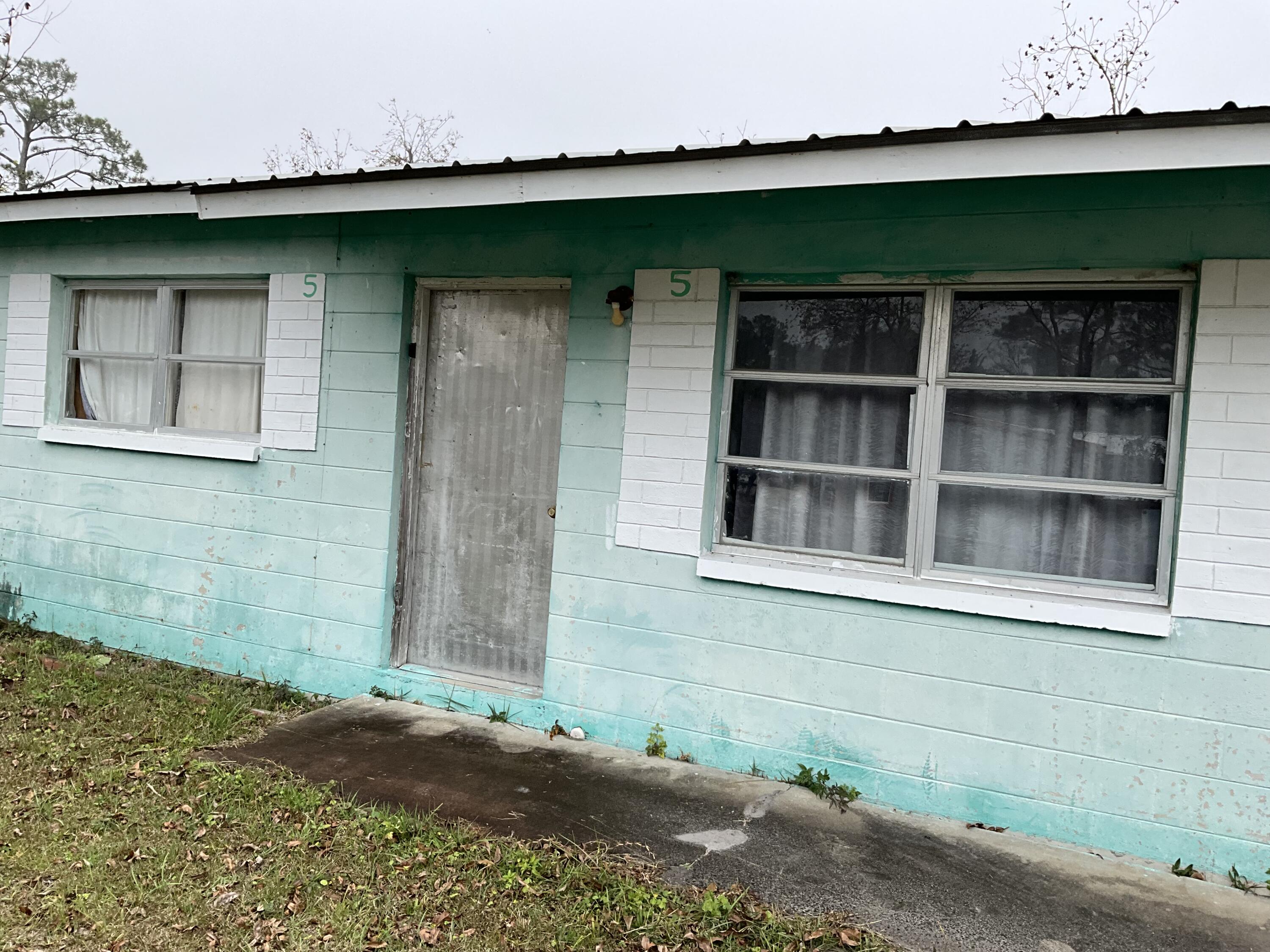 Fantastic Opportunity to own a little piece of Apalachicola History. The 2 bedroom/1 bathroom beach cottage sits on a .26 acre parcel with an additional mobile home on the back of the lot, Mixed use opportunities! The 2/1 home has a metal roof and both dwellings would be great to fix up and use as a summer getaways or vacation rentals. Situated on a large corner lot with pecan and pear trees and bay views. What are you waiting for! A property such as this one has so much offer and do not come on the market very often. The possibilities are endless! Call today