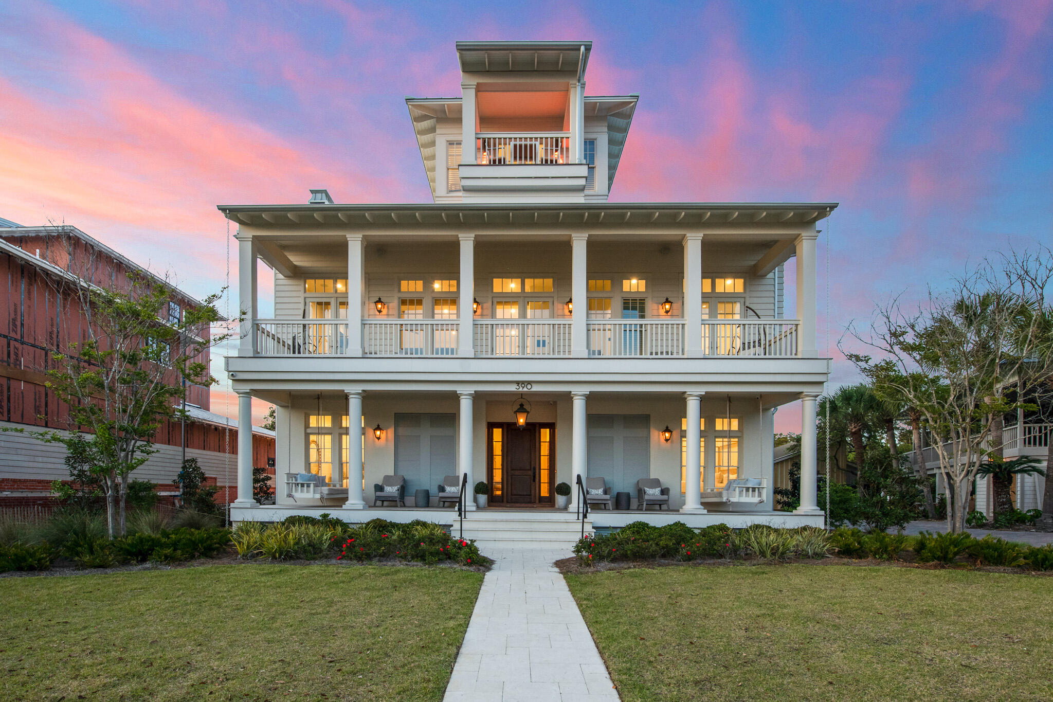 **Back on the market due to Buyers financing.** Home is in great condition with recent inspection.Welcome to Walton Rose! This exemplary home embodies every bit of the elegance and coastal charm that Inlet beach has to offer. Just a few steps from the sugar sand beaches and neighboring the highly sought after Rosemary Beach, this location is unsurpassed. 5 br/5.5 ba effortlessly accommodates the entire family with the main home and a carriage house. Spanning over 4,500 sq ft, studious detail was taken in the construction of this impeccable retreat, from the natural beamed raised ceilings and neutral hardwood flooring to the state of the art appliances, private elevator and adjacent carriage house. Large windows span across every room,