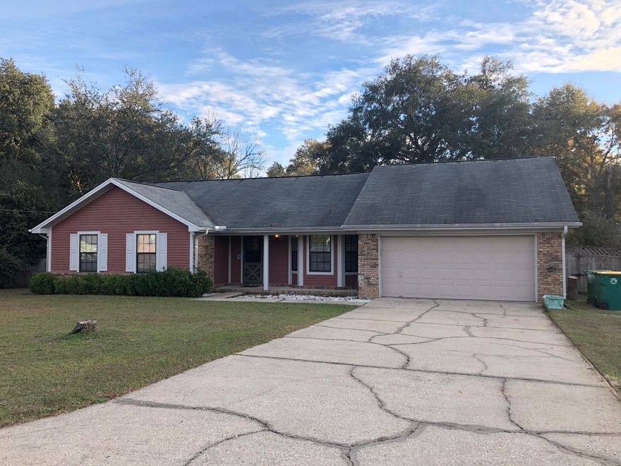 Rare find in South Crestview! With 4 bedrooms with 3 full baths, this home features two master suites. One with a sitting room and it's own hvac unit. The living room is inviting with high ceilings and a brick fireplace. The kitchen is flanked by a breakfast nook and formal dining room, and is updated with tile, newer cabinetry and counter tops, and a gas range. The additional bedrooms are tucked up away for privacy. Ample closets for all of you storage needs. A spacious level back yard is fully privacy fenced and features a large storage building. All of this, South of I-10, and COUNTY TAXES!