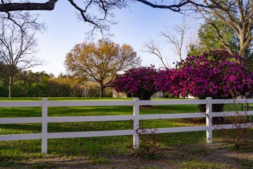 Look no further for your dream home/homesite/man camp! 45.56 lush, fully irrigated acres containing a barndominium. This property is beautifully landscaped with  pecan trees, plum trees, and persimmon trees. It averages 600 square bales of hay each year. It has a 3 stall barn with concrete pads, electricity and water in each stall, heated and cooled tack room, and 500 gallon ground storage tank.  The property boasts a detached garage/ workshop and barn for your equipment and toys. There are (3) 4 inch wells over 300 ft. The windmill produces only water and the water produced maintains the level in the pond. The pond is clay-lined. The underground utilities are in conduit. This parcel includes the acreage across the street with potable and irrigation water. Shop is totally insulated.