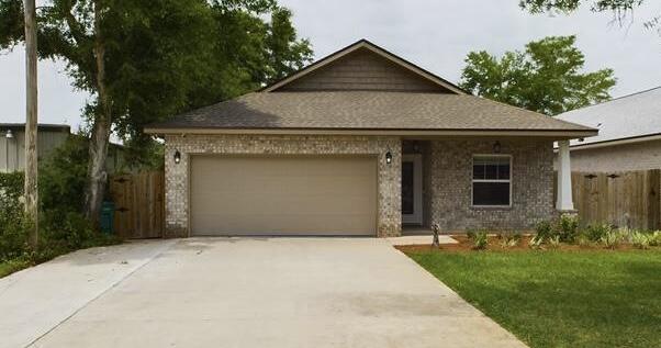 Seller paying up to $15,000 in buyers closing costs. Home nearly new home was previously occupied for only 1 year. This 4/3 custom brick home has super curb appeal. There are 10 Ft. Ceilings w/ impressive crown molding, has LVP flooring throughout most of the home except for the wet areas which are tiled. The gourmet kitchen boasts white cabinetry, granite countertops, a breakfast bar and stainless appliances including a full sized refrigerator and freezer. Bedrooms 1 and 2 are located near the front entry along with bathrooms 1 and 2. The master suite is located at the rear of the home and has a double vanity, 2 walk -in closets, and a combo tub and shower with a glass enclosure. The oversized great room is located at the front of the kitchen and opens to a covered porch that has an aluminum extension and extra concrete. Home comes complete with a well and sprinkler system, is fully sodded/ landscaped and fenced. There is also additional concrete in the front of the home for parking a third vehicle.