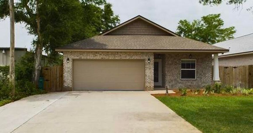 Seller paying up to $15,000 in buyers closing costs. Home nearly new home was previously occupied for only 1 year. This 4/3 custom brick home has super curb appeal. There are 10 Ft. Ceilings w/ impressive crown molding, has LVP flooring throughout most of the home except for the wet areas which are tiled. The gourmet kitchen boasts white cabinetry, granite countertops, a breakfast bar and stainless appliances including a full sized refrigerator and freezer. Bedrooms 1 and 2 are located near the front entry along with bathrooms 1 and 2. The master suite is located at the rear of the home and has a double vanity, 2 walk -in closets, and a combo tub and shower with a glass enclosure. The oversized great room is located at the front of the kitchen and opens to a covered porch that has an aluminum extension and extra concrete. Home comes complete with a well and sprinkler system, is fully sodded/ landscaped and fenced. There is also additional concrete in the front of the home for parking a third vehicle. 