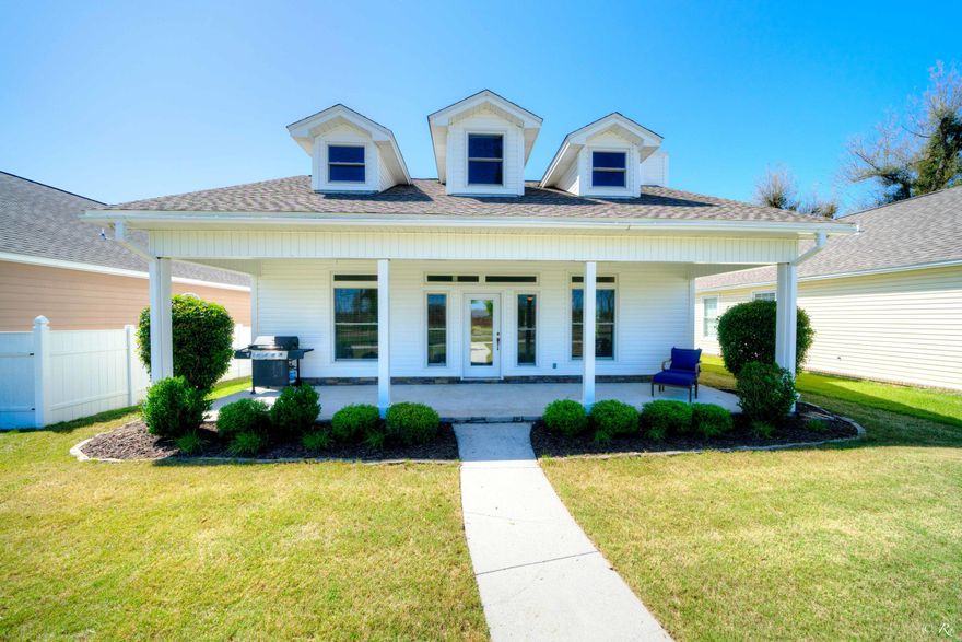 This beautiful home located in Riverside Park community boasts a large covered front porch with a new roof, new carpet and fresh paint. The spacious living room features an electric fireplace, perfect for cold winter nights; with trayed ceilings, recessed lighting, and tile floors throughout. The formal dining area leads into the eat-in kitchen; which boasts plentiful honey-colored cabinets, quartz countertops, a breakfast bar, and an entire wall of pantry space for your convenience. There is also a large foyer area leading out through the back door that could be used as a small office nook. The master suite features new carpeting and a trayed ceiling with a large master bathroom, featuring Corian countertops and shower/tub combo. The sizeable guest bedroom boasts a great view