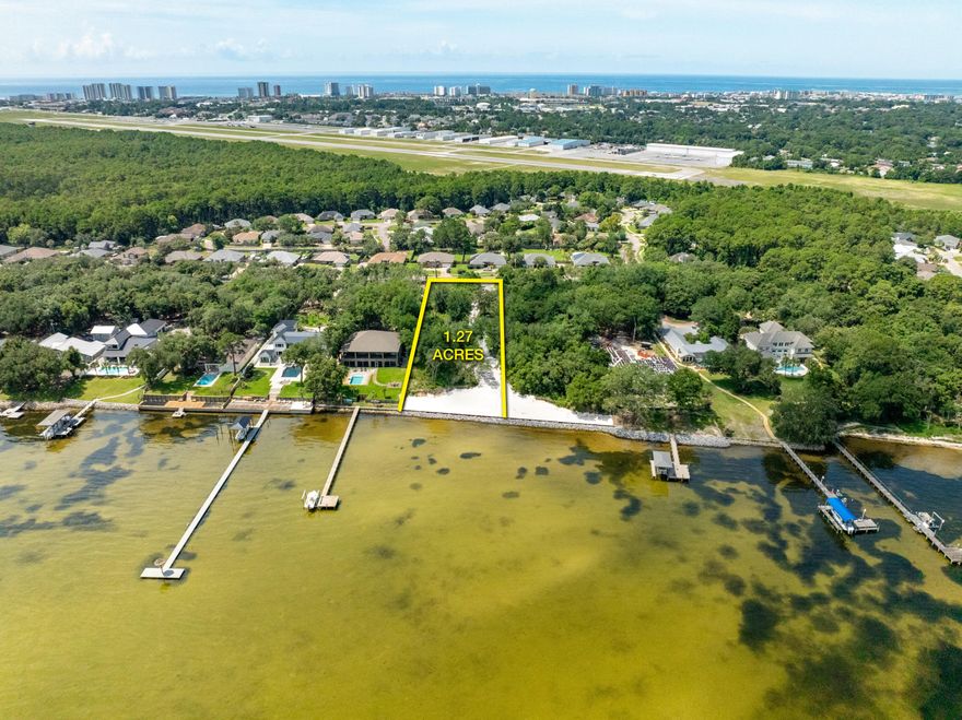 NEW BULKHEAD & SEAWALL &#9733; NO HOA!  Approximately 1.27 prime waterfront acreage oriented on the scenic Choctawhatchee Bay in Destin, Florida! One of the most impressive, vacant water-front parcels now offered for sale on Indian Trail, encompassing an extraordinary view corridor and vista across the scenic Choctawhatchee Bay. Very few premier, vacant waterfront lots remain in Destin for the custom design and construction of fabulous new residential enclave, especially one of this magnificence! This rare opportunity yields a substantial expanse of +/-128' fronting the bay, with boundary depths of +/-493' and +/-479', West and East boundaries, respectively. The topography and elevation of this phenomenal residential parcel is stunning and thus will offer substantial... savings for the site work involving the development of a custom waterfront compound, perhaps a main home, guest house, and garage.  Please inquire for further details and to schedule a private showing. A boundary survey is uploaded to this listing.