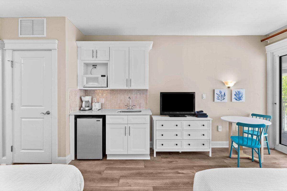 Experience the epitome of coastal living in this fully remodeled second-floor studio at Grand Sandestin, located in the renowned Sandestin(r) Golf and Beach Resort. This beautifully updated unit features brand-new luxury vinyl flooring, quartz countertops, custom cabinetry, and stylish new furnishings throughout. The kitchenette is well-appointed with a microwave, mini-fridge, new garbage disposal, and modern faucet--ideal for preparing quick meals. The spacious layout includes two comfortable queen beds, while the private balcony offers the perfect spot to enjoy Florida sunshine and peaceful resort views. Whether you're looking for a personal beach retreat or a high-performing investment property, this turnkey studio delivers exceptional value and convenience in a world-class resort.