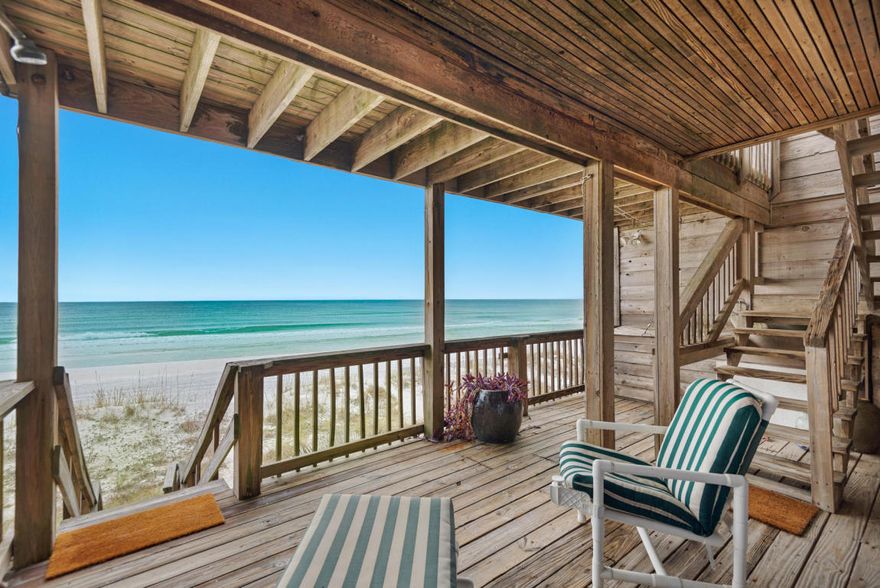 Prime BEACHFRONT location with panoramic views of the emerald green gulf & crystal white beach & private deeded beach access. NO HOA FEES!!! This 3-story townhome is solid built with triple treated cedar wood siding & metal roof. There's ample parking (5-6 vehicles), small garage perfect for a golf cart & extra storage, and beachfront balconies on every level. There's 2 HVACs and 2 water heaters to efficiently run this home. The first floor offers 2 guest bedrooms with private baths & sliding doors to the large covered deck with direct beach access. The 2nd floor is the main living with hardwood floors, 1/2 bath, open kitchen/dining and living room with unbelievable views of the gulf. The balcony offers a nice sunning deck with stairs leading down the beach as well.