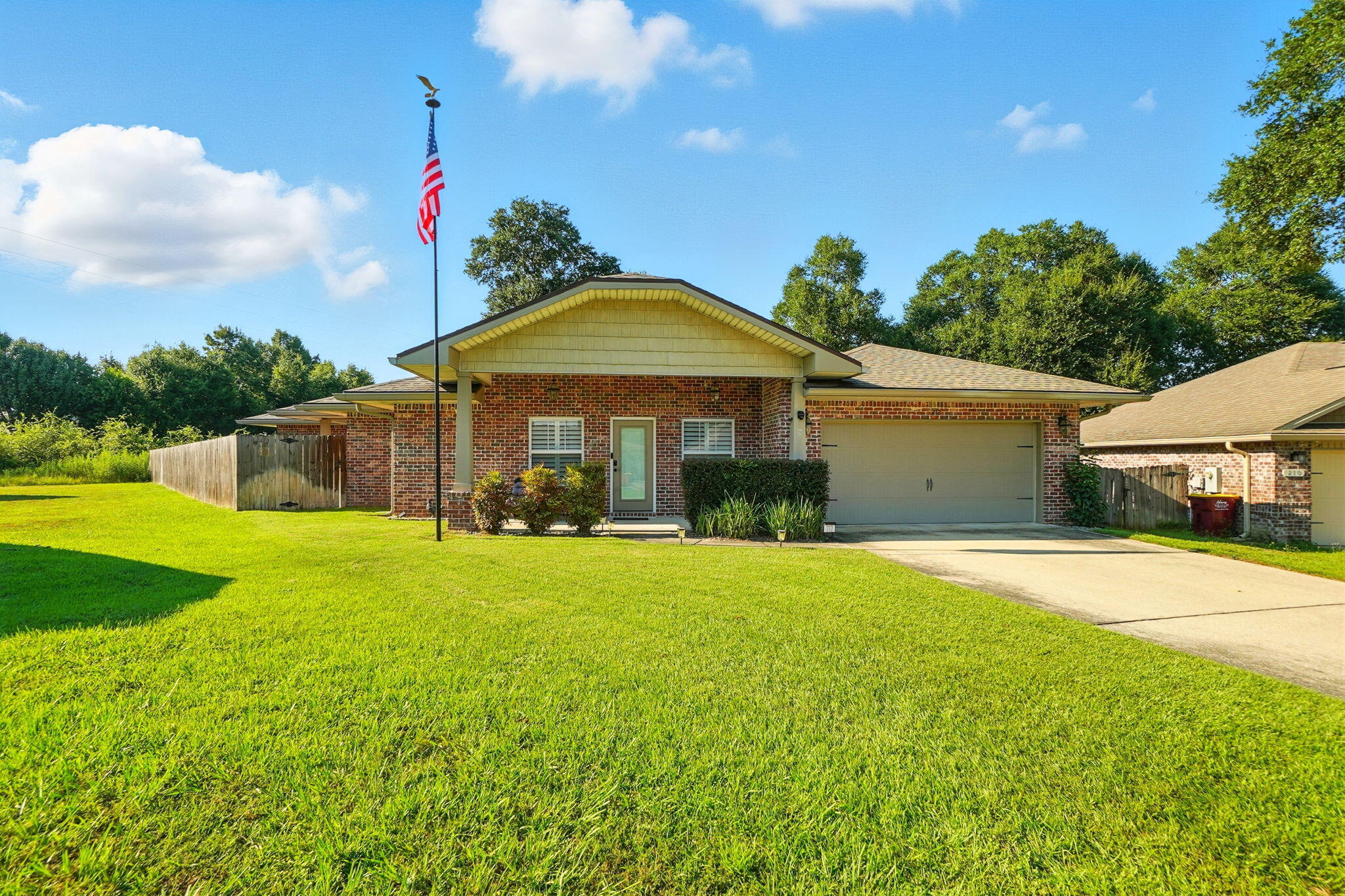 Welcome to 212 Eleases Crossing - the perfect blend of style, comfort, and convenience! This stunning 3-bed, 2-bath brick home sits on a quiet cul-de-sac with NO HOA. Inside, enjoy brand-new vinyl flooring, timeless plantation shutters, soaring 10-ft ceilings, open-floor and concept, and elegant crown molding. The kitchen is a true showstopper with a massive chef's refrigerator and sleek bar area, perfect for entertaining! The yard has been completely cleared of trees for a fresh, low-maintenance look. Washer, dryer, and Tesla charger convey. With tile throughout the main living areas and a grand 8-ft leaded glass entry, this home delivers on every detail. Survey available. Don't wait--Contact the listing agent today to schedule your private showing today!
