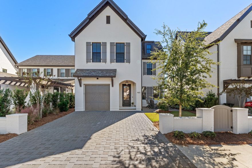 This home is such a jewel and is located in a no short term rental gated community. This home was built by one of Walton county's premier builders, Randy Wise. Upon entering the home's foyer you will find ship lapped white walls and wide planked wire brushed oak floors.The open concept kitchen, living room, and  extended dining area flow seamlessly together for friends and family to gather. The kitchen features a large island, pull out pantry shelves, and high end Fisher Paykel appliances. You will find a spacious front paver patio for gathering with the friendly neighbors, and a large screened porch off the back of the home. The porch features comfortable furniture, and outdoor tv/cable, surround sound, and security camera.The back patio has a gas grill connect and additional lighting. Also on this level you will find a charming powder room. Ascend the stairs and you'll find a shiplapped feature wall. On this level there is the large primary bedroom complete with shiplapped feature wall and ensuite bathroom and custom closet. Down the hall you'll find a laundry room with LG high efficiency washer/dryer. You'll find two more spacious bedrooms and a private 1/2 bath connected to each bedroom and a shared tub/shower area. There are so many upgrades in this home including the epoxy garage floor, 8 foot solid wood and glass doors, Rannai tankless water heater, and a beautiful Bevolo light fixture gracing the entrance. This home's lawn is cared for by the community. Live the maintenance free "Beach Life" that you've been waiting for. Take your cocktail and catch sunset at the close by beach access.