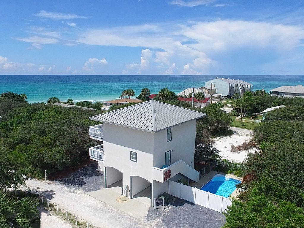 Gulf Views that are spectacular and unobstructed, beach access with private walkover, and private pool all on south side of 30A one lot from the beach in Seagrove. With beach access being difficult to find on 30A, the easement to beach access for this property makes it unique. This beach house has two garages and storage on first level; living area and one bedroom with full bath and laundry on second level, with all gulf side windows giving views; newly constructed wood stairs to third level atrium with master bedroom and bath and access the gulf side balcony plus a third bedroom with full bath. Exterior Poolside stairs with entrance to rear of house. Selling ''AS-IS''.