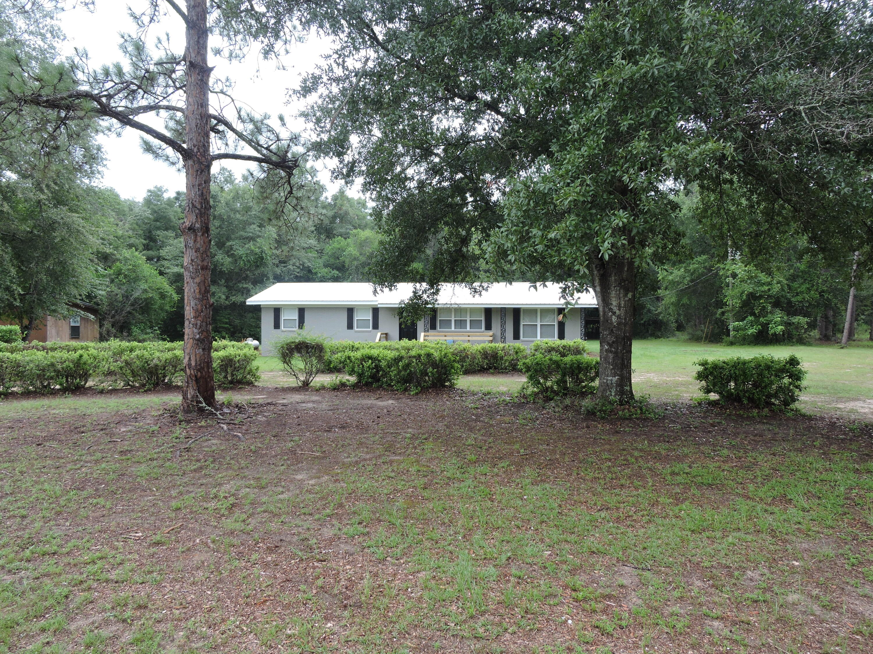 Available NOW! Recently remodeled from top to bottom with upgrades galore! The main house has the beautiful original real hardwood flooring sanded and resealed. The kitchen has been completely redone with new cabinets, countertops, and appliances. A new utility room was added with laundry center and additional cabinetry for storage/pantry. The new master suite has a walk-in shower, new vanity and walk in closet. The additional bedrooms are nice sized with ample closet space. The home has covered front and back porches to relax and enjoy your morning coffee. Schedule your provate showing today!