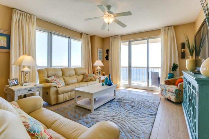 This exceptional, 1,577s.ft. condo lives like a house but comes with all the benefits of owning a condo. Conveys with luxurious beach inspired furnishings and artwork that welcome you to lie back and relax with views of the beach and ocean. The fully equipped kitchen features upgrades such as solid granite kitchen countertops & black appliances. Upgraded with ceramic plank tile throughout! The sunrise and sunset views from the 46' private, eastern facing, wrap-around balcony are a perfect end to a sunny day and beginning to an exciting evening - the ultimate in alfresco living! This massive condo has 3 bedrooms & 3 full bathrooms. MAIN MASTER BEDROOM is front and center on the beach with access to the main balcony and private bath with garden tub and separate shower.