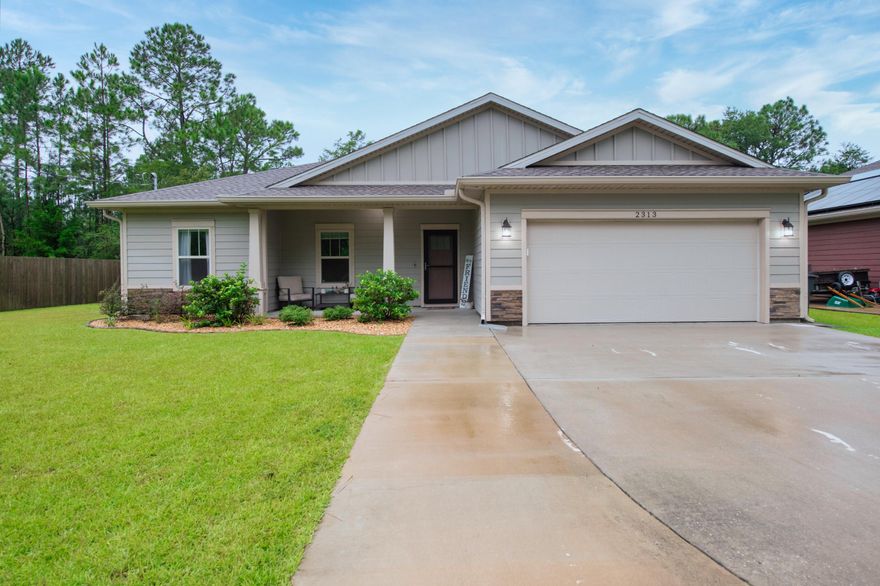 Better than new, located East of the Navarre Bridge! This home being only a few years old offers granite countertops throughout, semi custom cabinetry, beautiful glass cut outs about doorways, trey ceilings, crown molding, gutters, sprinkler system, fenced backyard, stainless steel appliances, blackout blinds and light filtering in living area! This home features an open concept which is perfect for entertaining as well as a well sized primary bedroom with on suite bathroom featuring shower, garden tub, double sinks, and oversized closets! Seller will pay off solar loan and leave washer/dryer with full price offer.This home also has solar panels which assist with energy billing! Don't miss the opportunity to view this home today!