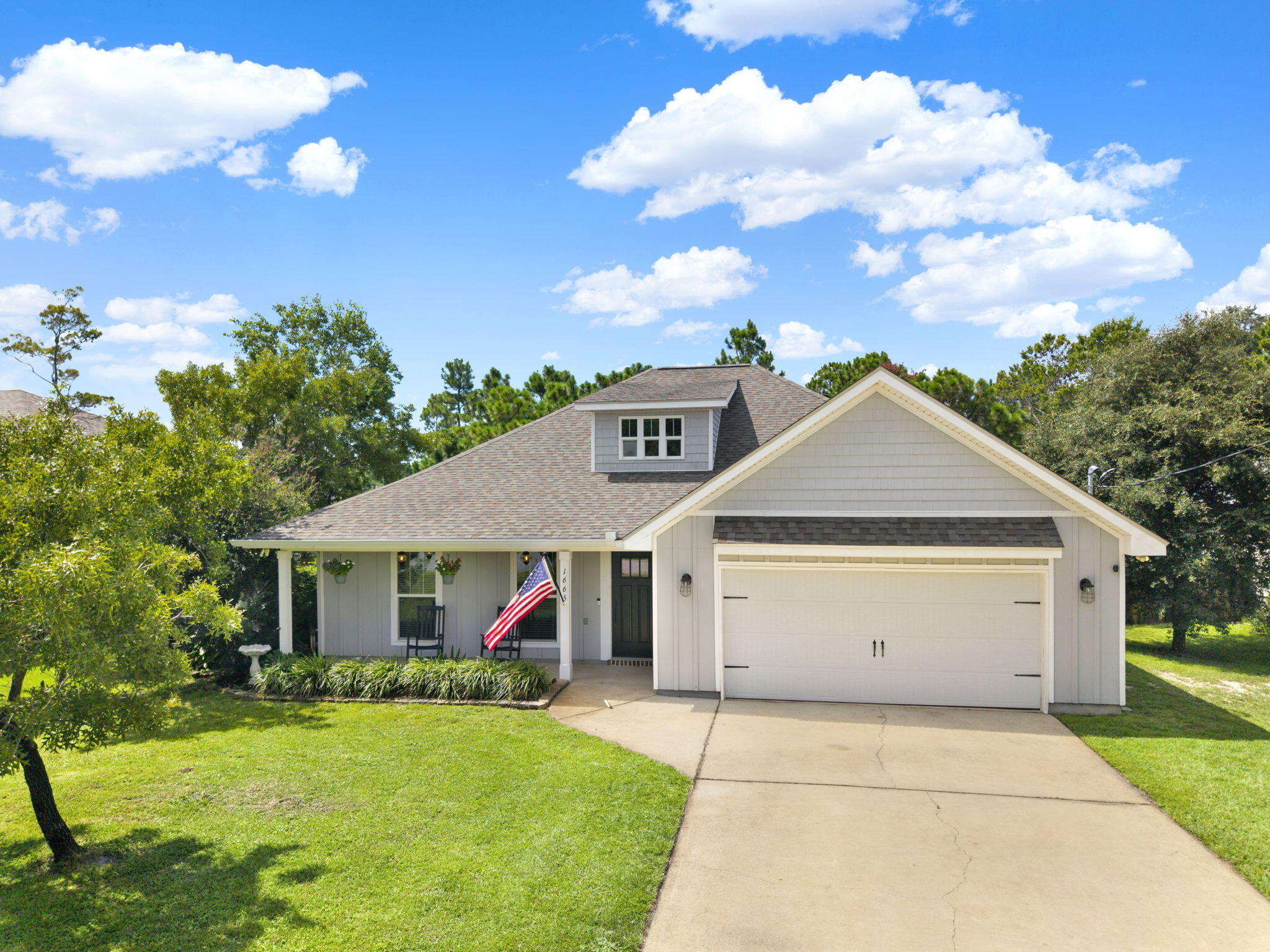 Welcome to this beautifully designed 3-bedroom, 2-bathroom home in the heart of Gulf Breeze, custom-built in 2018 and offering 1,805 square feet of thoughtfully crafted living space. Nestled just 0.7 miles from the Woodlawn Beach boat launch and only 3.7 miles from the serene Soundside Foundation Nature Preserve, this home offers the perfect balance of comfort, convenience, and coastal living. Step inside to an inviting open-concept living area featuring elegant wainscoting, an electric fireplace, and oversized windows that fill the space with natural light and offer charming views of the front yard and garden. The chef's kitchen is a standout with granite countertops, shaker cabinets, stainless steel appliances, and a classic subway tile backsplash.... A separate office space near the back door provides the perfect spot to work from home, with a lovely view of the garden's orange tree. The spacious screened-in back porch is ideal for relaxing or entertaining. The large, fenced backyard includes a firepit and garden area, creating your own private outdoor oasis.
Throughout the home, you'll find durable and stylish LVP and tile flooring, along with a dedicated laundry room and generously sized bedrooms. The luxurious primary suite boasts a tray ceiling with chandelier, two large windows overlooking the backyard, and a spa-like en-suite bath featuring a dual vanity, soaking tub, separate shower, and a roomy walk-in closet.
Additional highlights include a 2-car garage with pull-down stairs leading to a large attic for extra storage, a well-fed sprinkler system, and a beautiful neighborhood setting. Located 0.9 miles from Woodlawn Beach Middle School and just 1.2 miles from the upcoming Soundside High School, this home is perfectly situated for families.
Only 10 minutes to Navarre Beach and 24 minutes to downtown Pensacola, you're never far from a day on the water, local dining, shopping, and entertainment.
Don't miss your chance to own this exceptional Gulf Breeze gem. schedule your private showing today!