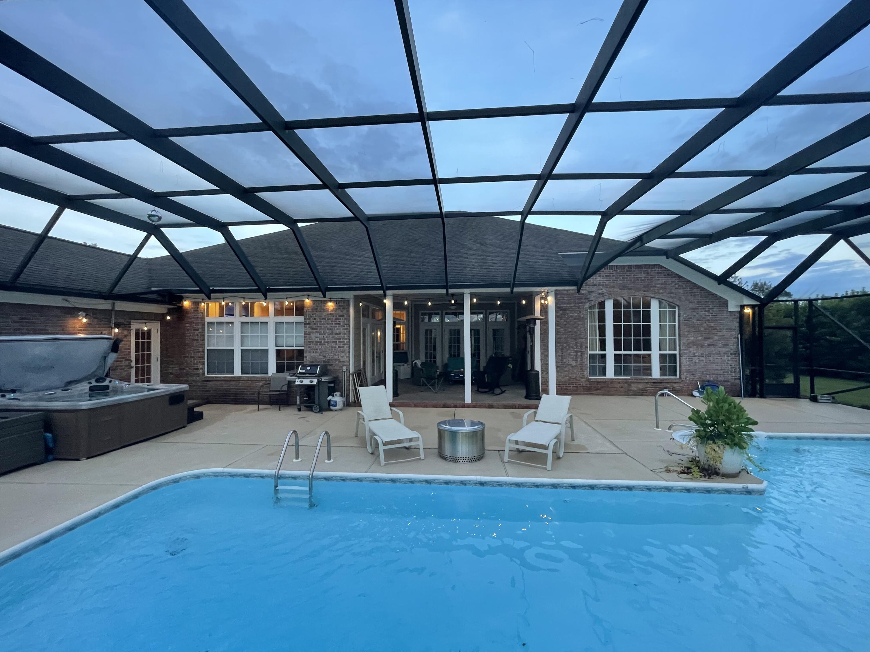 MUST SEE this incredible home with huge pool perfect for entertaining friends with endless sunsets! This 4BR with office, 3.5BA home backs up to the 14th hole with mature landscaping for privacy. It features 12 ft ceilings, crown molding throughout, a huge master suite with custom built closet and a 20X40ft screened in swimming pool and hot tub in the back. Inside you will enjoy a gourmet kitchen, featuring granite countertops, stainless steel appliances, and a gas cooktop, gas fireplace with shiplap accent and NEW ROOF. This home also includes two living areas so everyone can have their space, which open to covered patio and pool . Windswept Estates is a beautiful public golf course community featuring a community pool, tennis courts & Low HOA!