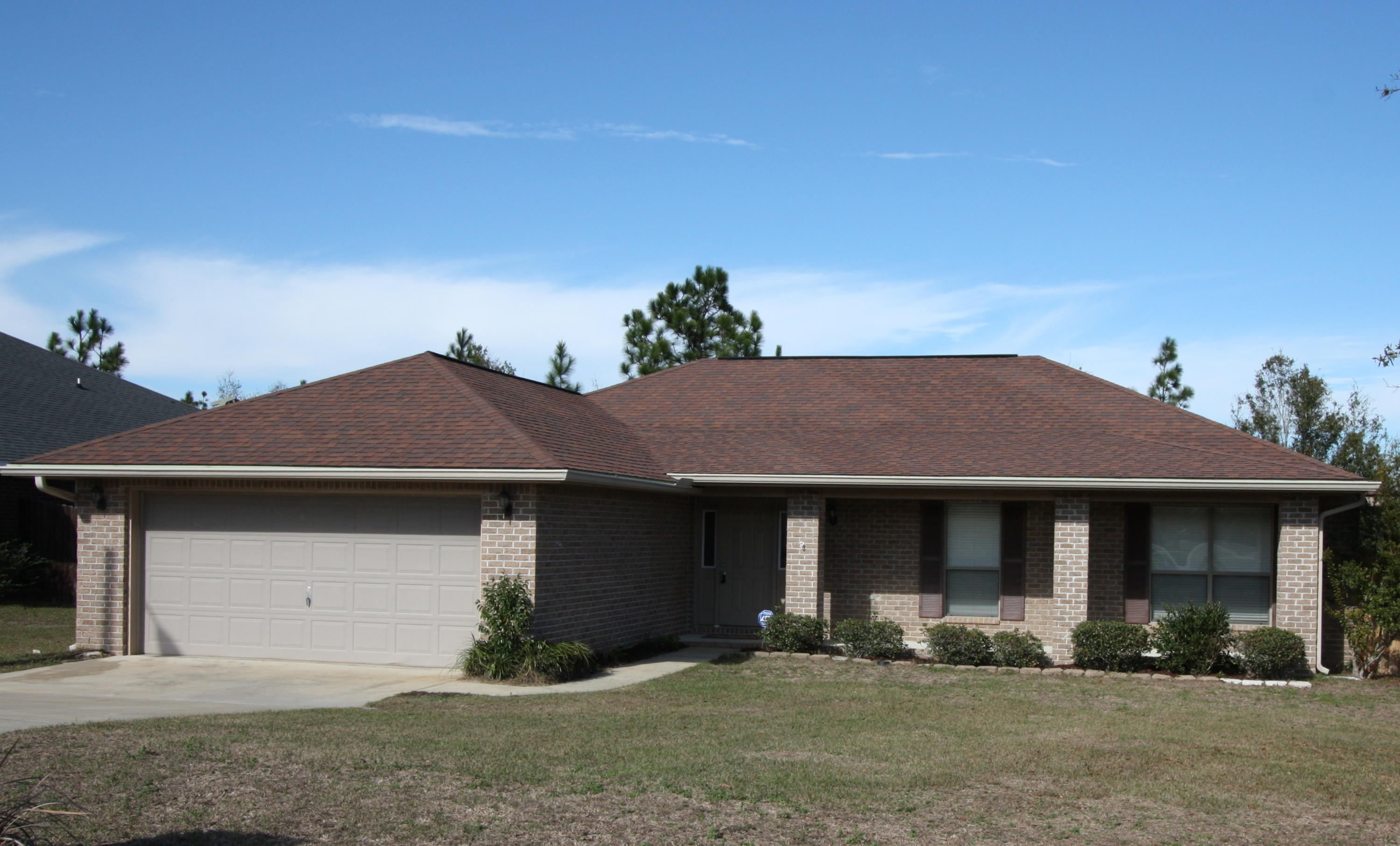 This beautiful 4 bedroom 2 bath, all brick home is situated on a large .22 acre lot and it is ready for you to call it home. The modern open floor plan features vaulted ceilings, a large kitchen with stainless steel appliances and a great room which is accented by a wood burning fireplace. In the common areas you will be delighted by the visually stunning new flooring which has a foam underlayment, reducing noise and providing a shock absorbing cushion. The master bath is very spacious with a garden tub, separate shower, large walk in closet and double vanities. Nice added touches include brushed nickel fixtures and faux wood blinds throughout the home. Off the kitchen is a nice sized laundry room. Enjoy entertaining on your back patio in your fully fenced back yard.