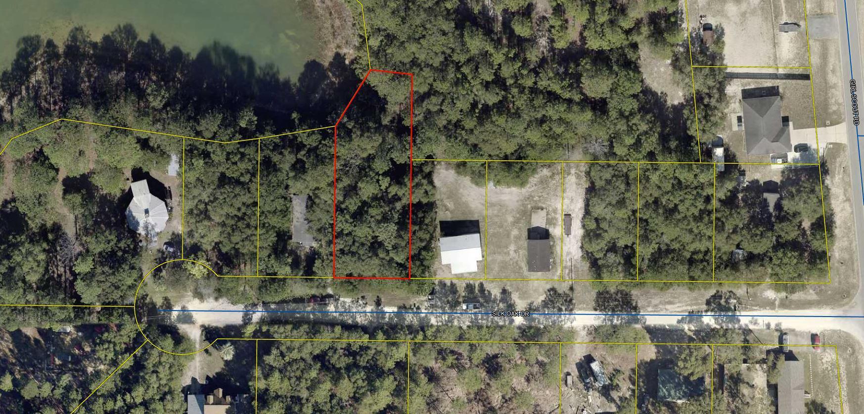 Waterfront Lot just off Hwy 90 W and Girl Scout Road located on Silk Oak Road. This beautiful waterfront lot borders beautiful Beaver Lake. Community water is available through Mossy Head Water Dept. Lot is wooded with a slight slope as most waterfront lots in the area. This would be the perfect place to live on such a pretty lake or have a mobile home just as a weekend fishing spot. Just off the newly paved Girl Scout Road. Lot dimensions subject to an up-to-date survey to be ordered.