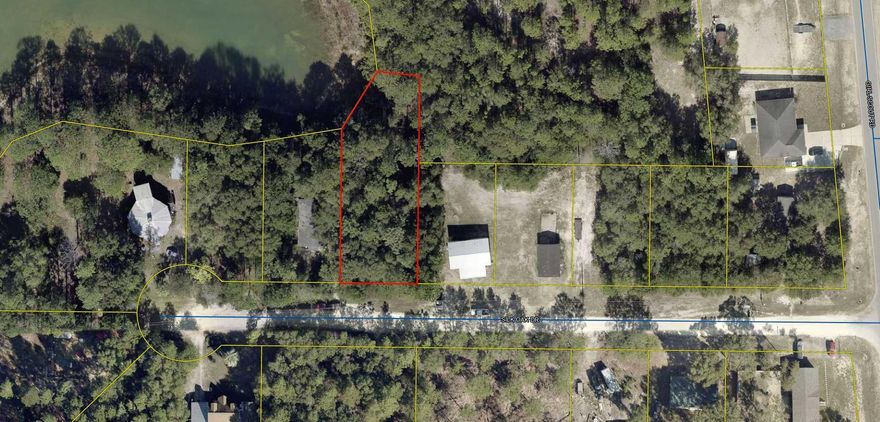 Waterfront Lot just off Hwy 90 W and Girl Scout Road located on Silk Oak Road.  This beautiful waterfront lot borders beautiful Beaver Lake.  Community water is available through Mossy Head Water Dept.   Lot is wooded with a slight slope as most waterfront lots in the area.  This would be the perfect place to live on such a pretty lake or have a mobile home just as a weekend fishing spot.  Just off the newly paved Girl Scout Road.  Lot dimensions subject to an up-to-date survey to be ordered.