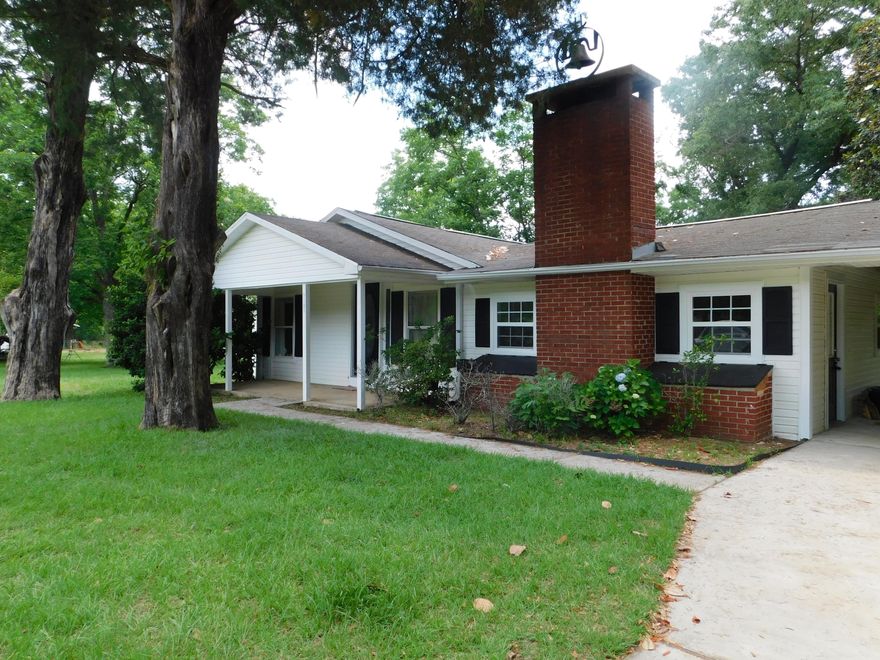 Home in the country! With a heated and cooled work shop! Welcome home to 2.26 Acres with lots of shade trees, peace, and quiet!! Remodeled with new flooring and freshly painted walls. Check out the kitchen with it's custom cabinetry and stainless appliances!! New Carpet! French doors open up to the green grass and beautiful view! Large Heated and cooled workshop with lots of storage and room for the tools, along with a chicken coop, dog pen, or place to keep your goats!