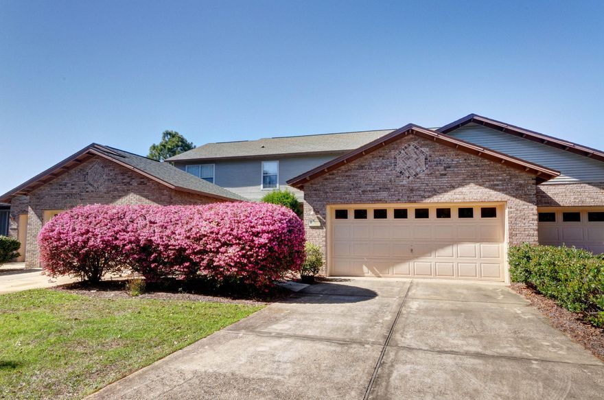 Owner has added all NEW wood plank tile flooring on the first level! Three bedroom, two bath town home with vaulted ceilings and an open floor plan. Beautiful screened porch with a view of the pond and fountain, there is a two car garage with a large laundry room off of the kitchen. This incredibly maintained town home is south of 98 and close to everything, the beaches of 30A, Grand Boulevard for shopping, dining and entertainment, Sacred Heart Hospital and all of the fun on Scenic 30A! The town home is directly across the street from the community pool, clubhouse, playground and picnic area. The tennis courts are just around the corner and an easy walk. Don't miss out on the opportunity to own this lovely home at a great price that is close to everything!