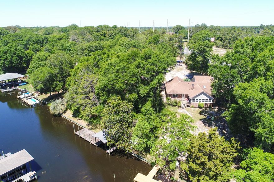 IT'S A DREAM COME TRUE TO FIND AFFORDABLE WATERFRONT LIVING IN NICEVILLE! Are you looking for that perfect spot to launch a kayak or paddleboard from your dock? Take a look at this spacious and updated three-bedroom, two-bath home with an oversized two-car garage that sits on an impressive 0.6 acre lot. Live the Florida lifestyle in this delightful home positioned on a protected canal that meanders out into the Choctawhatchee Bay and beyond. The home sits high and dry with no flood insurance required. Sip your morning coffee on the private back deck and take in the views!