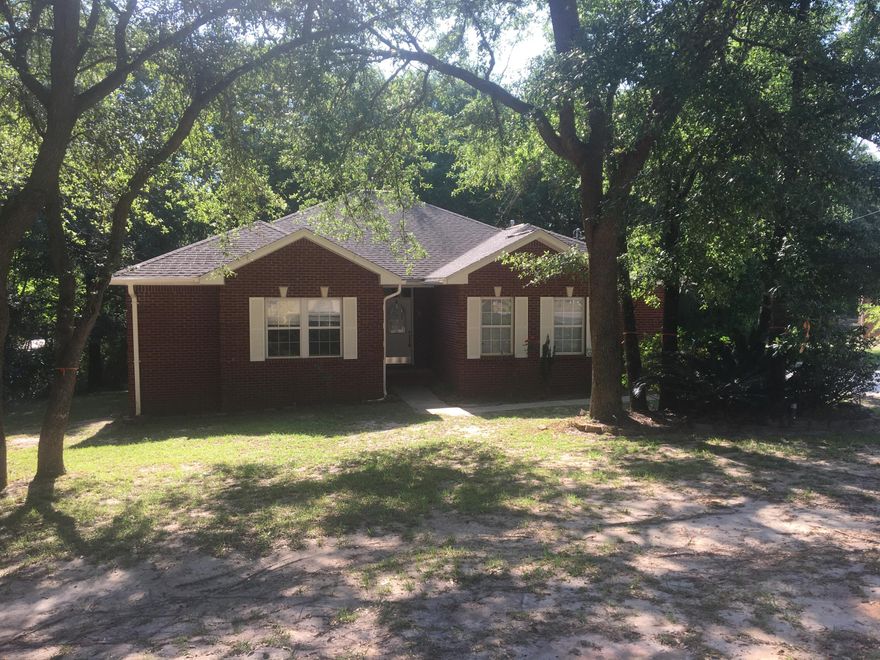 Beautiful 3 Bed, 2 Bath, 2 Car Garage all brick home on 1/2 acre lot in the desirable Indian Trails Subdivision. Built in 2003, this home has many custom details including an open floor plan. The Great Room includes Living Room, Dining Room, and Kitchen. The spacious kitchen is a cook's dream, featuring gas cook top, lighted pot rack, lots of counter space, custom cabinets, and in-wall oven. Home has tile and laminate wood flooring in the common areas and carpet in the bedrooms and hallway. The back door leads to a sizable deck and patio and backyard with plenty of mature trees for shade. The master bathroom has a garden tub & separate walk in shower as well as his and her pedestal sinks. All bedrooms have ceiling fans and huge walk in closets.