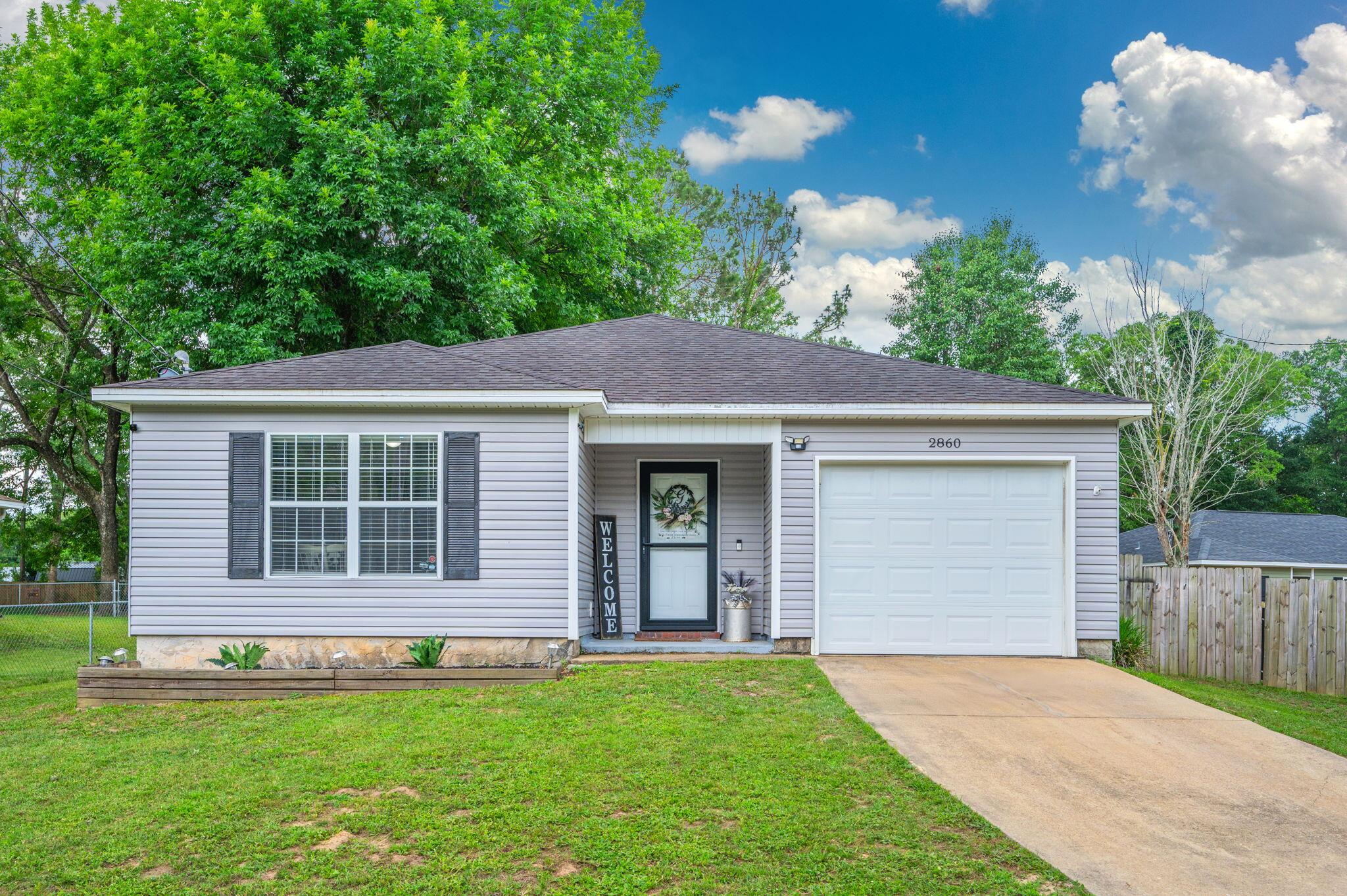 Discover this charming 3-bedroom, 2-bath home nestled in the heart of Crestview, offering the perfect blend of peaceful country living with the convenience of nearby shopping and dining. Situated on nearly half an acre, this well-maintained home features a desirable split-bedroom floor plan, ideal for young families or first-time homebuyers. The open-concept kitchen seamlessly connects to the family room, dining area, and a bright sunroom--creating a welcoming space for entertaining or relaxing with loved ones. The master suite is thoughtfully set apart, boasting a spacious walk-in closet, while the two additional bedrooms share a full bath at the front of the home. Step outside to a generous backyard complete with a brand-new 10x16 shed and a cozy chicken coop- perfect for those who appreciate fresh eggs and a touch of homesteading. Priced to sell and move-in ready, this lovingly cared-for home is a must-see!
Buyer to verify all dimensions.