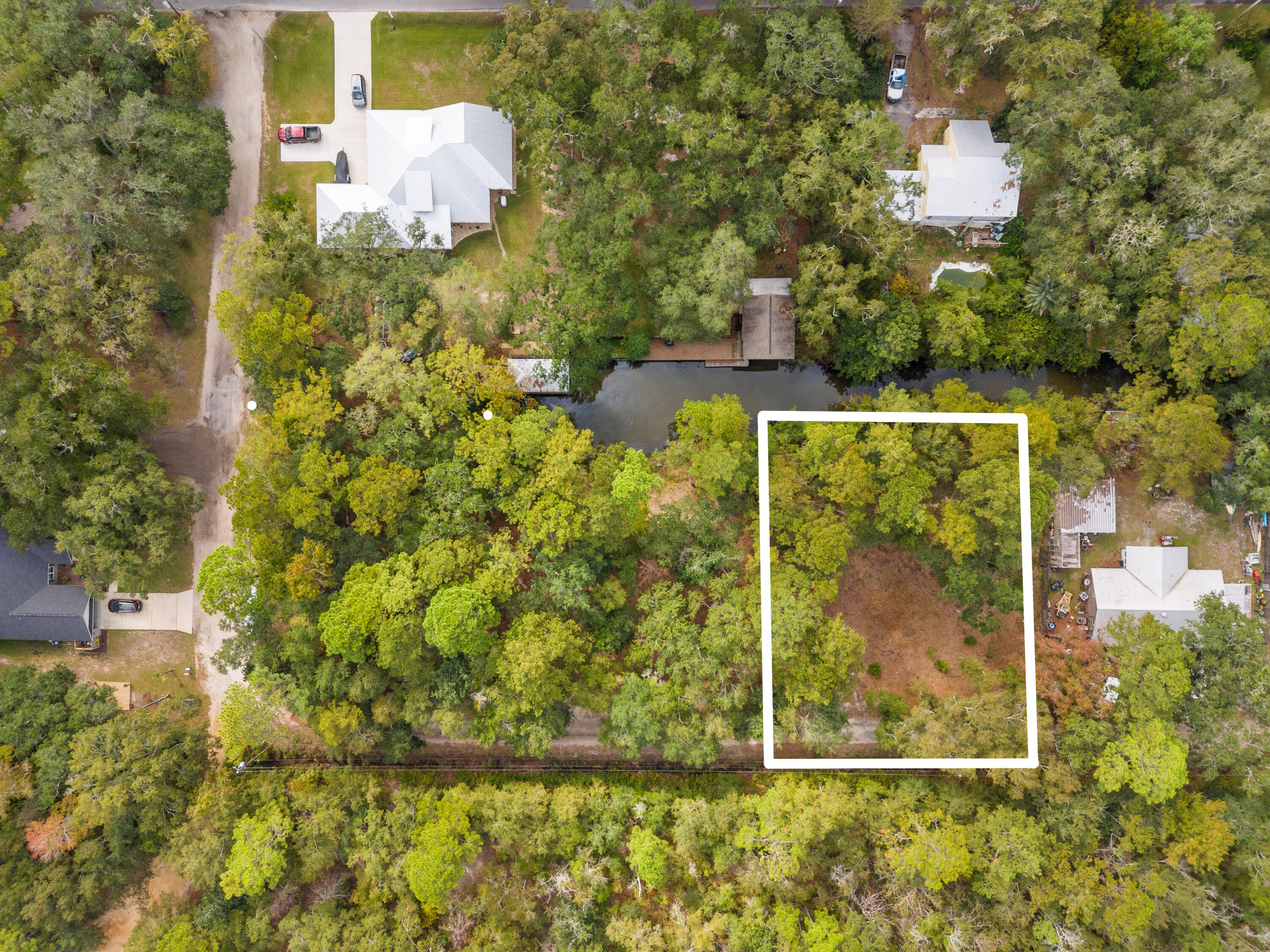 WATERFRONT lot (or lots) with no HOA! Private canal with access to the Choctawhatchee Bay. Build to suit your home complete with privacy and peacefulness at your fingertips. Public water and sewer taps available through Freeport City Utilities. Land is in Flood zone X, high and dry. Sellers have had a pontoon in the canal, specific depths are not known. Permits for dock are allowed, soil survey also completed. (information only can be provided to buyer) 2 Adjacent lots available also. See MLS #962230 and 962231