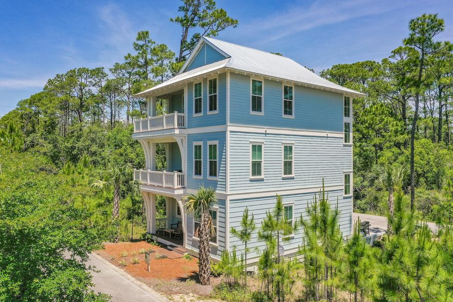 This beautiful, fully furnished five bedroom, five and a half bath property offers gated access to the Seacrest beach neighborhood as well as a direct access to highway 98. This home has three stories with a desirable open floor plan that includes features such as two master suites with cathedral ceilings, a gourmet chef's kitchen fully equipped for entertaining, coastal whitewashed hand scraped hardwood floors. Multiple porches to enjoy the tranquil outdoor environment as well as shiplap accents and designer finishes throughout. Designed for both an end user or short term rental. The home is adjacent to the resort style community pool.