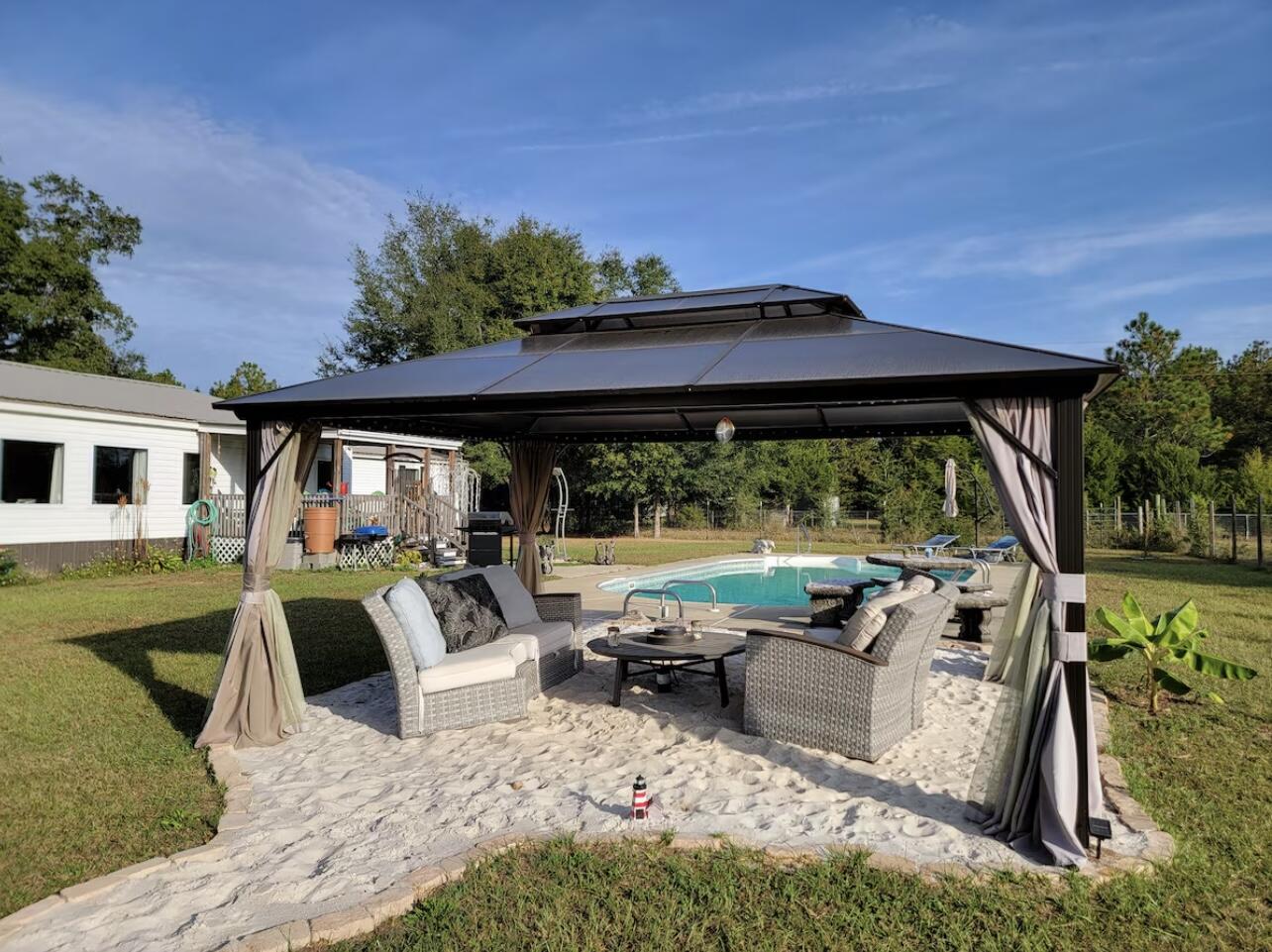 4-Bed, 3-Bath home on 1.09 Acres with Pool and Income-Producing! This is perfect for families or investors! Featuring an open floor plan, spacious kitchen, private primary suite, and a fenced-in pool, it's ideal for relaxing or entertaining. The carport and large lot offer plenty of space for parking, play, or future expansion. Currently used as a successful short-term rental, this property is move-in ready. Enjoy country living just 10 minutes from I-10.