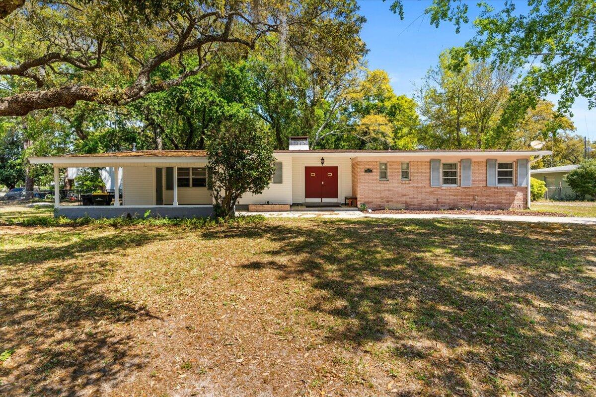 Priced to sell!!Motivated seller. This beautifully updated home is located in the charming Elliott Point neighborhood, on a large corner lot with great curb appeal. Inside, you'll find travertine tile in all the wet areas and stylish ebony wood floors throughout the living spaces and bedrooms. The open floor plan features a modern kitchen with espresso maple cabinets, granite countertops, stainless steel appliances, and a unique mosaic tile backsplash. Freshly removed popcorn ceilings for a modern touch. There's also a cozy family room with a shiplap ceiling that leads out to the backyard. Enjoy the covered patio with a ceiling fan and light. The large yard includes an extra patio and a shed added in 2020, and there's convenient laundry access both inside and outside. This is a home you won't want to miss. Washer, dryer, and shed convey as-is. New roof installed in 2018. New water heater in 2023. HVAC and new electrical updated in 2015