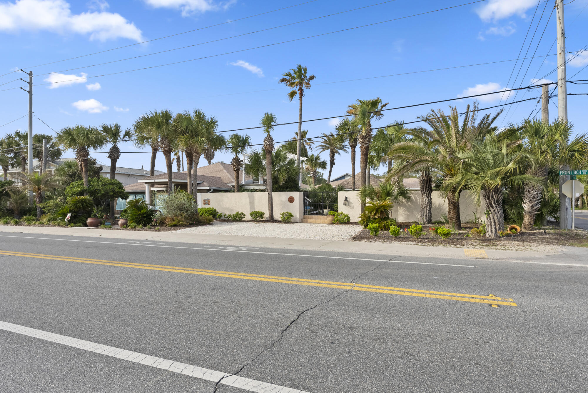 Just REDUCED and available to show by appointment ~Step Back in Time to Timeless Coastal Elegance~Welcome to a true mid-century treasure. This solid 1952 concrete block home is a beautifully preserved gem that blends vintage charm, historic character, and relaxed coastal living--just steps from the Gulf of Mexico. Rich in craftsmanship and soul, this six-bedroom, four-bathroom property is located in the highly sought-after Laguna Beach community and offers a rare opportunity to own a piece of Old Florida magic, directly across from Public Beach Access 80.An Expansive, Private Coastal EstateThoughtfully expanded to over 4,297 square feet, this double-lot estate is quietly tucked behind lush garden walls, offering privacy and tranquility. Once inside the gates, you'll discover a world of its own, where tropical landscaping, cascading wisteria, and tranquil fountains surround an enchanting outdoor retreat. At the heart of it all lies a sparkling saltwater pool, a shaded gazebo, and a Gulf-view deckperfect for everything from quiet mornings to sunset gatherings.

Main Residence - 4 Bedrooms / 3 Bathrooms

The primary home showcases timeless mid-century architecture, highlighted by original woodwork, tongue-and-groove ceilings, and elegant stamped concrete floors. Bright and airy interiors are filled with natural light and authentic character throughout. A formal sitting room, anchored by a grand piano, provides the perfect space for hosting elegant soir??es or intimate evenings. Two front bedrooms share a charming retro-tiled hall bathroom, evoking a sense of nostalgia and classic design. Additionally, two spacious master suites, each with its own private en-suite bath, offer comfort and privacy for family or guests.

Charming Guest House - 2 Bedrooms / 1 Bathroom

Separated from the main home by a private entrance, the guest house offers two bedrooms and one full bathroom. This inviting space includes an open-concept kitchen and living area, in-unit laundry, and large sliding glass doors that open directly to the pool and gardens. With its own entrance and lockout capability, the guest house is ideal for visiting family, in-laws, vacation rentals, or use as a secluded home office.

A Living Experience, Not Just a Home

Every corner of this property is designed to inspire a deep connection to its surroundingsfrom sun-drenched mornings by the pool to candlelit dinners under the stars in the garden courtyard. Offered nearly fully furnished, the home is turn-key and filled with carefully curated touches that reflect timeless style and soulful elegance.

Whether you're seeking a peaceful sanctuary, a multi-generational retreat, or an exceptional income-producing investment, this rare Laguna Beach estate offers unmatched flexibility, space, and charmjust steps from the sugar-white sands of the Gulf.

This is more than just a home. It's a hidden world waiting to be discovered.