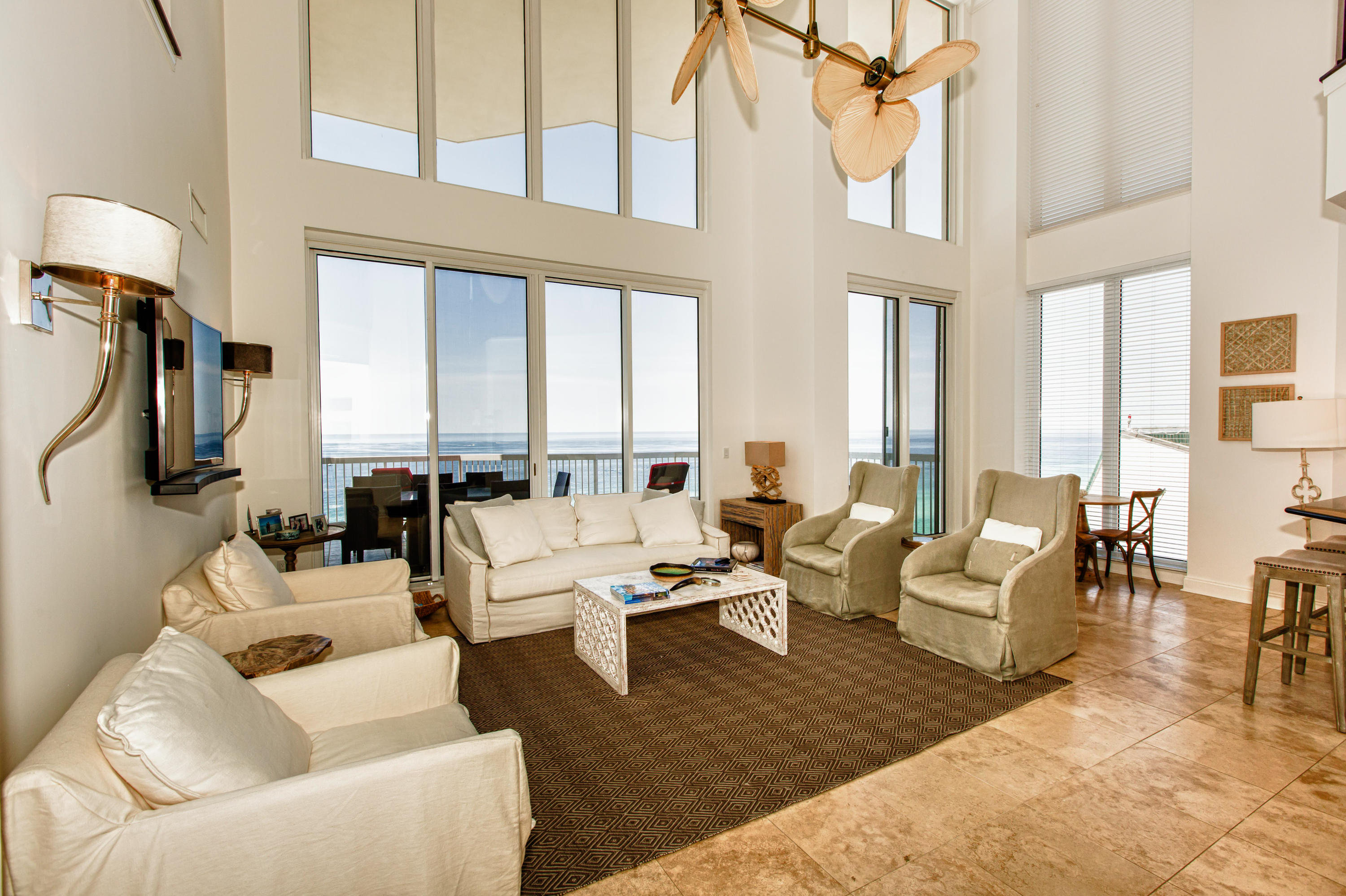 Enjoy soaring gulf front views through floor to ceiling glass in the two story great room of this exclusive newly remodeled/furnished private residence Silver Beach Towers Penthouse. Two gulf front master bedroom suites, three additional bedrooms with loft family room and separate dining room. New features include travertine and hardwood flooring, upscale lighting fixtures and chandeliers, new paint,new wall mounted smart tv's , retooled kitchen cabinets with glass doors and over and under LED lighting.Closet converted to game room.Wine refrig. New upscale designer furniture, furnishings,art and household items.. New patio furniture for all three terraces. This 3860 SF home conveys furnished with exception of some wall art. 2 car garage. 3 terraces. A must see for the discerning buyer.