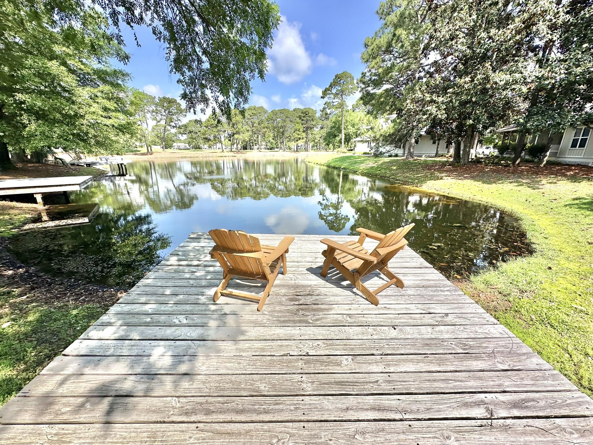 The wait is finally over! Welcome to 1114 Prestwick Place where you will find everything you have been searching for within Sandestin Golf & Beach Resort(r) and have yet to be able find all under one roof! Or make that two, because this home even features a detached garage. This home has been recently updated and upgraded from floor to ceiling. Featuring everything from all new flooring to overhead lighting, you will notice the inviting open space as you enter and feel like you stepped off the resort into a tranquil retreat. As you look toward the lake, you will find it even has its own private dock on the water, just steps outside the magnificent screened-in porch. The phenomenal kitchen renovation just begs for an excuse to entertain or simply enjoy getting a glass of juice.