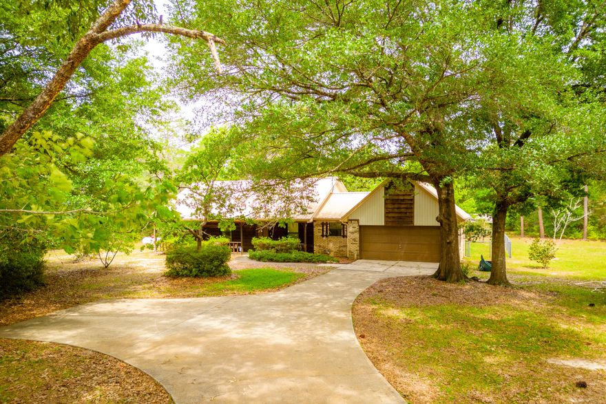 BRICK HOME on nearly 4 1/2 ACRES.. NOW AVAILABLE.. and this one comes with RV HOOKUP..  2 STORAGE SHEDS and WHOLE HOUSE GENERATOR!This 3 BR/2 Bath brick and cedar estate is nestled on a sprawling corner lot surrounded by MATURE HARDWOODS, FLORIDIAN PINES and STATELY MAGNOLIAS!  There's a covered front porch and a covered back patio.. perfect for watching migratory songbirds or grazing deer.Inside you'll find a sunken living room with stone 'wood-burning' fireplace!  There's also a formal dining room; just off the living room. The country kitchen features custom oak cabinetry and breakfast area.All bedrooms are spacious; including the master suite which boasts a marble tub/shower combo and a skylight!Of course the real appeal is the land .. nearly 4 1/2 acres! What will you do with the acreage? Lot split? Pool? Garden? Endless options.. and so much potential!

COUNTY TAXES.. QUICK COMMUTE TO THE BASE.. AND PRICED TO MOVE! 

Homes sitting on this much acreage are rare in Crestview.. particularly for this price! Make an offer today! 