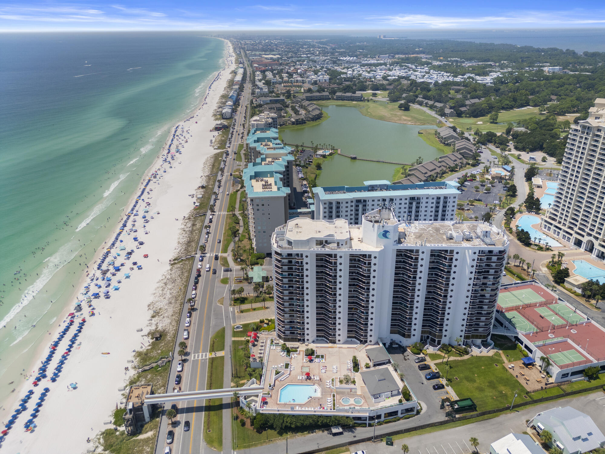 Indulge in magnificent views of the Gulf of Mexico and the Choctawhatchee Bay from the 14th floor of this 2-bed/2-bath condo. The spacious balcony provides the perfect spot to savor breathtaking sunsets and is accessible from both bedrooms and the living space. This property boasts newer floors, appliances, and paint, making it ready for immediate occupancy. The separate entrance to one of the bedrooms allows for flexible rental options. A Murphy bed in the living area offers additional sleeping space. Plus, the convenience of a washer/dryer in the spacious primary bathroom adds to the appeal of this unit. Surfside Resort and Spa has much to offer, full spa, beach bar, restaurant, pool (heated in winter), and so much more! Call/text/email with any additional questions!