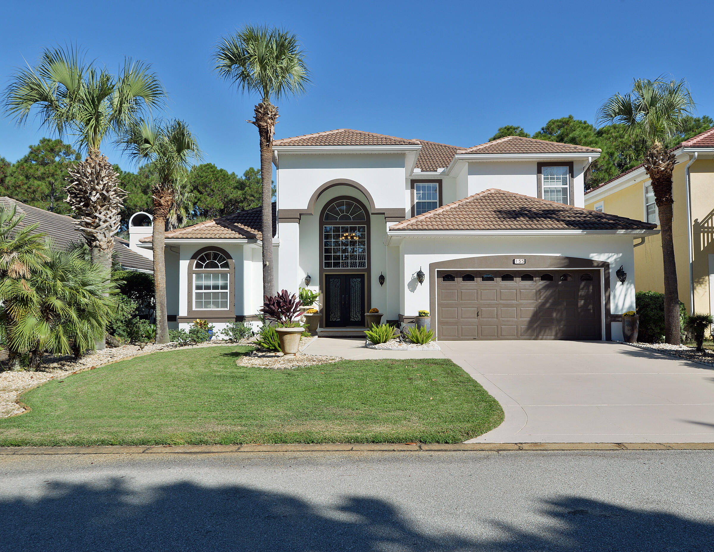 This Luxurious Custom-built home is nestled in the HIGHLY sought after golf community of Emerald Bay! Boasting a brand-new exterior facelift with a stunning Pearl synthetic paint and driveway painted in Desert Sandstone, this executive home makes you stop and say WOW!! 155 Indigo Loop has EVERYTHING to offer, and nothing left out, updated with granite counter tops, Bosch appliances, triple crown molding, upgraded baseboards, HVAC is only 3 years old and water heater is 1 year old. The Master bedroom is conveniently located on the 1st floor. Pool area is equipped with hot tub, BBQ grill that has gas lines permanently attached to the home! Screened in with lights makes for an amazing evening around the pool. Looking for a gorgeous home!