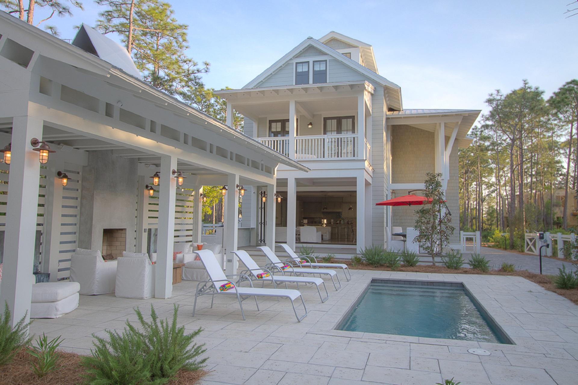 Located on the most coveted street in WC on one of the largest lots in WC, this 6 bd 6.5 ba. house has it all!Open concept floor plan with a wall of lift and slide windows opening to a huge entertainment area featuring a pool, pool cabana complete with fire place and wall fountains, outdoor shower, outdoor kitchen and plenty of room for large group gatherings. This home features a two car garage with a carriage house above, in addition to 5 other ensuite bedrooms and a tower. This large lot is fully fenced and gated with tons of parking, this home is has everything needed to be an amazing full time home. Very few if any homes in WC have the parking capacity this home has making its income potential tremendous!