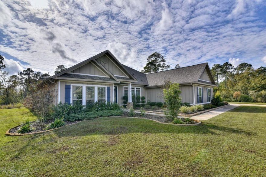 Exquisite and Immaculately maintained better than new elegant home in the beautiful, secluded, natural setting of Fanning Bayou. This stunning home has many upgrades and was built for entertaining family and friends . In addition to Granite counters, custom Tuscan-style back splash, Stainless appliances, Hardwood floors, trey ceilings, double arches, crown molding, and spacious open floor plan, it has an over sized covered patio with a Summer kitchen just oozing with wow factor! Includes built in grill, smoker, cook top, granite counters, tiled back splash, brick bar, a gas fire pit and hot tub, six ceiling fans, and all enclosed with no-see-em proof screen, so you can comfortably enjoy the natural landscape year round. Truly a must see home!