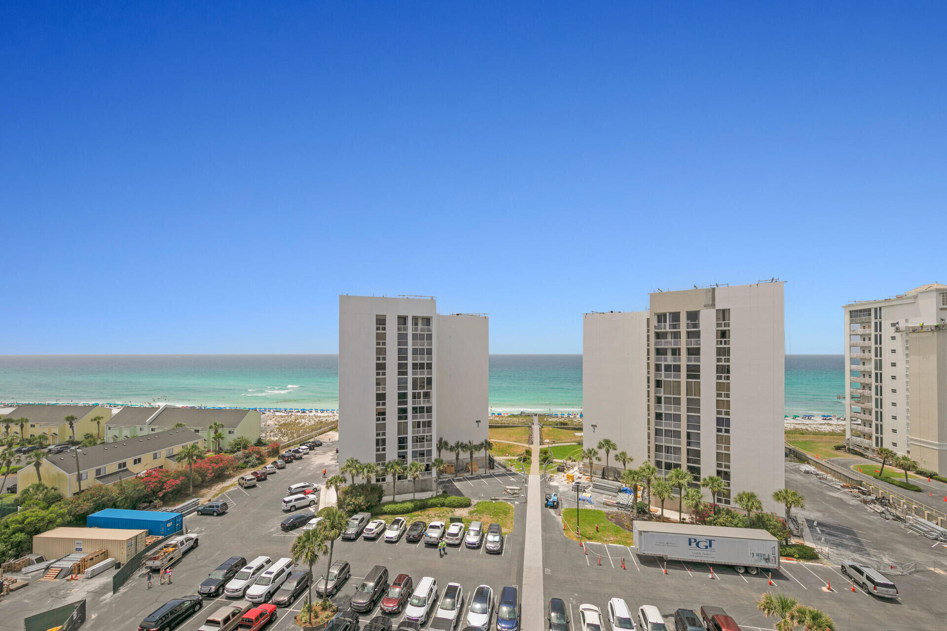THE WAIT IS OVER! This 3 bedroom corner unit has a RARE oversized sunroom and is a RARE FIND! This spacious and stunning Destin condo features both modern amenities and architectural character in a fantastic, gated beach community. Priced to sell! Offering 1800 Sq Ft - this spacious unit is one your friends, family and vacationing guests will cherish for a lifetime. The expansive kitchen boasts stunning endless countertops, stainless steel appliances + more. The condo has high-end finishes, a spacious sunroom, king-size bed in the master, 2 queen beds in guest rooms and so much room! Phenominal rental history follows this unit and with $65k-$80k yearly rental potential, this is a perfect return on investment. Centrally located Gulf front resort with 24/7 gated patrol, beach access + more! Shoreline Towers on Holiday Isle, an iconic destination, is completing a $20 million renovation. The upgrades include new hurricane impact doors and windows, exterior renovations, plumbing improvements, and beautification efforts. The complex offers impressive amenities such as a heated pool, tennis courts, sauna, spa, community room, dedicated owner parking, a fishing lake, and deeded beach access. With proximity to the beach, shopping, and restaurants, it's a perfect retreat with modern features and a refreshed atmosphere.