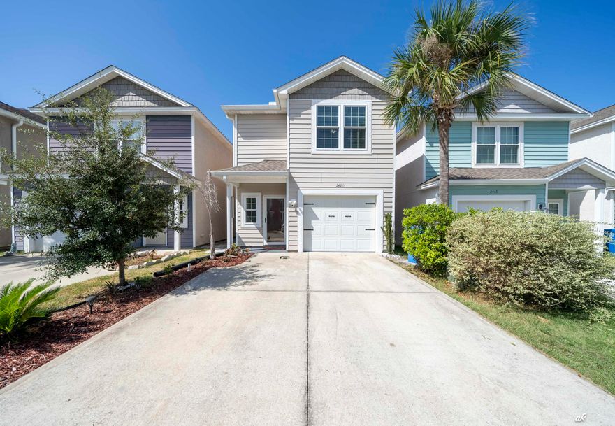 Tucked away on the east end of Panama City Beach, 2420 Causeway Manor Court offers a quiet, private setting just minutes from everything that makes beach life effortless. This spacious 4-bedroom, 2.5-bath home features inviting front and back porches, high ceilings, and an attached garage, all within walking distance to local restaurants, grocery stores, and a short drive to the Navy Base, top-rated schools, Bay Point golf courses, and the white-sand beaches of the Gulf. Inside, the kitchen shines with granite countertops, stainless steel appliances, and a breakfast bar, perfect for casual mornings or entertaining guests. The open floor plan and tall ceilings create a bright, airy feel throughout the living spaces. Whether you're looking for a primary residence or a long-term rental investment, this property is a rare findfour-bedroom homes on the beach side of town in this price range don't come along often. Enjoy a peaceful, off-the-beaten-path location that still keeps you close to St. Andrews State Park, beaches, nightlife, and endless dining options. Bring your sandals, sunglasses and experience life at the beach in the best way!