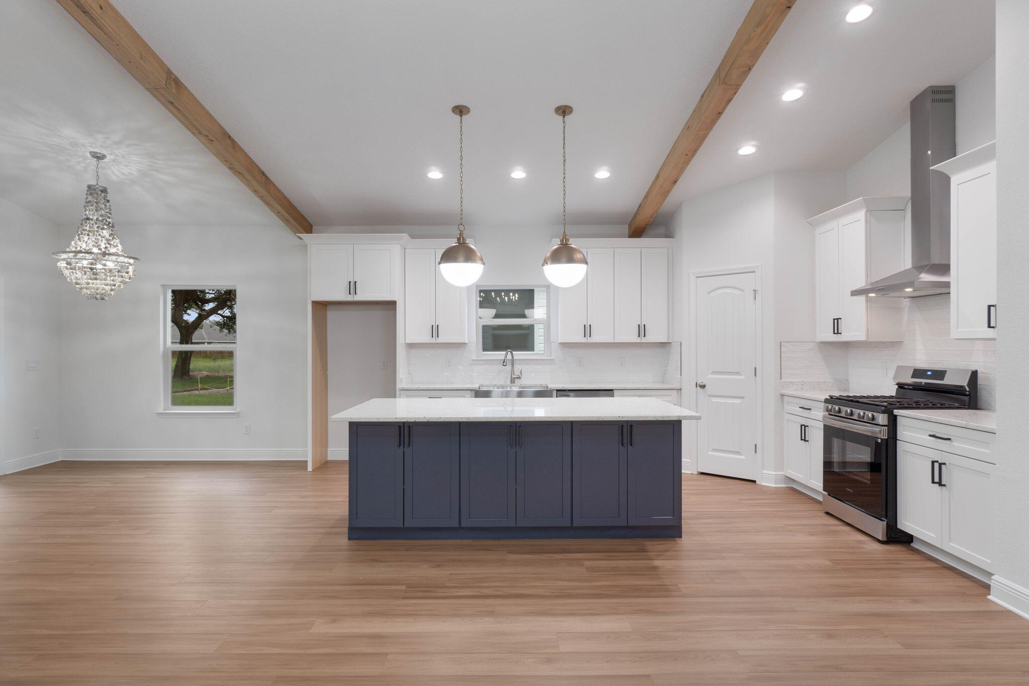 THESE ARE STOCK PHOTOS- NOT ACTUAL LOT SPECIFIC FINISHES. PHOTOS ARE OF SIMILAR PROPERTIES THAT WERE BUILT. We do have the same floor plan you can tour in the same neighborhood. Welcome to your dream home! This semi-custom craftsman inspired brand new home offers almost 2000 square feet of spacious living with 4 bedrooms, 2 bathrooms, and endless opportunities to make it your own. The home's standout features include custom cypress wood beams and vaulted ceilings, adding warmth and character to the already beautiful design. Beautiful fireplace, gas range, and tankless hot water heater make for a modern and comfortable living experience that you'll enjoy every day. The master bathroom boasts a luxurious free-standing tub and beautifully tiled shower, offering a spa-like experience at home. You'll never have to worry about running out of hot water with the tankless water heater - a feature that is sure to impress. But what truly sets this home apart is the opportunity to personalize it to your exact preferences. You'll have the chance to choose from 10 different flooring options, select your preferred granite color, and even pick out the cabinet colors that speak to you. This is not your average builder-grade house - it's a true gem waiting for your personal touch. This incredible home is brought to you by family-owned business that builds homes with heart. When you purchase this home, you'll not only be investing in a beautiful property but in a company that values integrity, craftsmanship, and customer satisfaction. We take pride in every home we build and ensures that each one is a reflection of our commitment to quality and excellence. With a focus on personalized service and attention to detail, you can trust that your home-buying experience will be second to none. Don't miss out on this opportunity to own a beautiful, semi-custom home built by a company with a heart. Contact us today to learn more about how you can make this house your forever home.