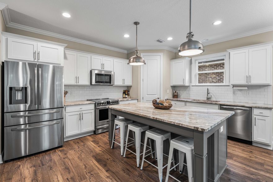 Beautifully crafted 2021 Randy Wise home in Laurel Oaks! This 4BR/2.5BA + office offers 2,200+ sqft, an open main floor, 1st-floor primary suite, 8' doors, crown molding & custom finishes. Upgrades include a custom primary closet, all new Zoysia sod, updated landscaping and pavers, laminate floors, custom blinds, fenced yard & custom office doors. Family-friendly neighborhood, all just 25 minutes from the sugar-white sands of 30A! **SELLER OFFERING $5,000 TOWARDS BUYER'S CLOSING COSTS WITH AN ACCEPTABLE OFFER.** Room sizes are approximate and subject to error.
