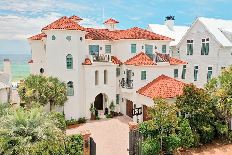 Commanding 75' of Gulf frontage from the highest bluff along Florida's Emerald Coast, 756 Blue Mountain Road is more than a home; it is a fortress of refined coastal living. Completed by the renowned Davis Dunn Construction, its structure is a masterclass in elevated engineering: brick masonry and stucco over insulated concrete, designed to withstand time, tide, and the elements without sacrificing elegance. This is not simply a residence built by the beach; it is one of the rare Gulf-front estates where beauty and permanence are given equal weight, and where every detail, from foundation to finish, speaks to an uncompromising standard. Spanning over 8,200 square feet behind a gated brick courtyard, the home has been newly refined to reflect the ease and sophistication of modern coastal life.

From the moment of entry, the tone is set: whitewashed hardwood floors, curated lighting, and fresh finishes offer a softened palette that mirrors the ever-changing hues of the Gulf just beyond. The main leveldesigned for daily life and effortless entertainingflows through open living and dining spaces to a south-facing pool terrace, where newly retiled surfaces and fire bowls frame the sea beyond.

The chef's kitchen, scaled for hosting and grounded by its clean lines, connects seamlessly to the living spaces, while walls of glass welcome in the horizon. Step outside, and the tempo slowsprivate pool, spa, and a boardwalk leading directly to the sand and surf.

With seven ensuite bedrooms thoughtfully arranged throughout, the layout supports both connection and privacy. The owner's level occupies the top floor entirelyfeaturing a spa-like bath, dual closets, private sun deck, office, and sitting room, all oriented to maximize light and Gulf views. An observatory crowns the home with wraparound views that stretch far beyond the shoreline.

The second floor is home to a grand leisure retreat,a space designed for unhurried days and unforgettable nights. Styled with the same coastal sophistication that runs throughout the home, it's the ultimate game escape, perfect for billiards, cards, or simply gathering with friends after sunset. Rich textures, layered lighting, and Gulf breezes spilling through nearby balconies make it a destination in itself, blurring the line between relaxed play and refined living.

Behind its beauty, the home's systems quietly elevate daily life: a geothermal heating and cooling system for efficiency and comfort, a whole-house water filtration system, a private irrigation well, and a newly installed whole-house generator. Every element has been considered to ensure the home's performance matches its presence.

Every detail has been quietly consideredfrom the whitewashed floors to the newly refinished surfaces, soft coastal palette, and elevated lighting throughout. Offered fully furnished with curated exclusions, this is a home that speaks in a language of restraint, elegance, and enduring quality.

Positioned in the heart of Blue Mountain Beach along 30A, with proximity to Seaside, WaterColor, and world-class dining and shopping, 756 Blue Mountain is not just a residenceit's a legacy anchored in sand and sea.