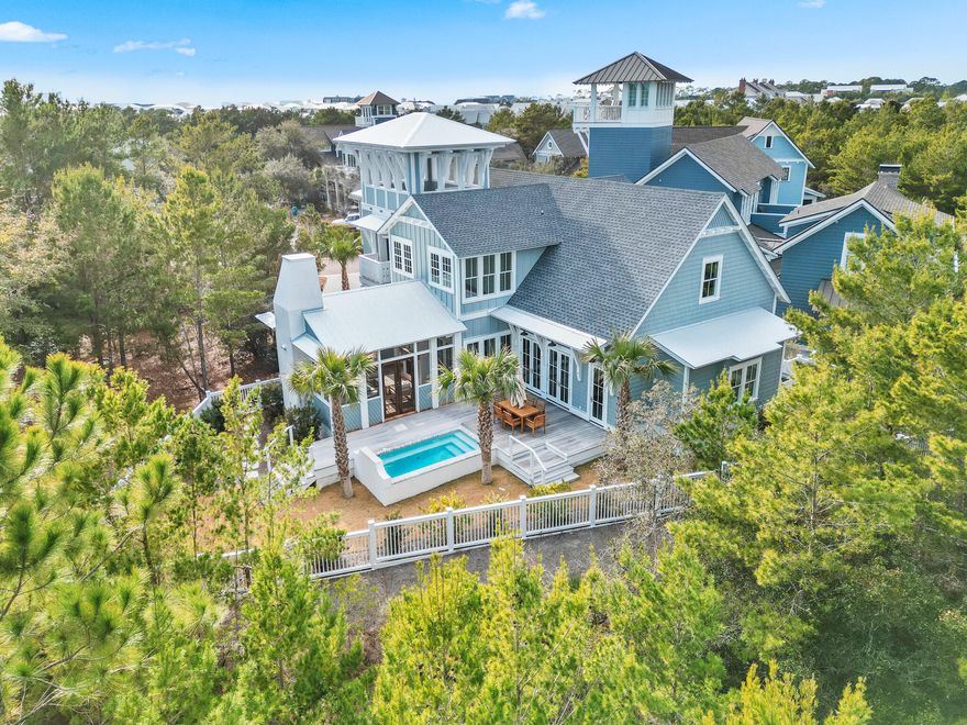 Introducing 80 Shore Bridge Circle, a masterfully crafted coastal residence nestled within the coveted Bridges neighborhood of the gated Watersound Beach community. Tucked away in a private cul-de-sac just moments from the sugar-white sands of Scenic Highway 30A, this home seamlessly blends timeless architecture, refined finishes, and effortless coastal living.The residence features five generously appointed bedrooms, each with a private ensuite bath, along with five-and-a-half baths designed with both elegance and functionality in mind. The first-floor primary suite serves as a tranquil retreat, highlighted by vertical pecky cypress accents, marble-clad bath finishes, and a spa-inspired ambiance ideal for unwinding after a day at the beach. Upon entry, reclaimed oak hardwood floors, soaring vaulted ceilings, and exposed wood beams create an immediate sense of warmth and sophistication. Venetian plaster walls grace the entire first level, adding texture and understated luxury throughout the open-concept living spaces. Designer lighting and a gas fireplace further elevate the atmosphere, making the home equally suited for intimate evenings or upscale entertaining.
The chef's kitchen is both striking and functional, outfitted with Wolf and Sub-Zero appliances, custom cabinetry, and a wet bar designed for hosting with ease. An oversized laundry room with additional storage and a deep sink adds thoughtful convenience without sacrificing style.
Indoor and outdoor living blend seamlessly, opening to a private courtyard featuring a resort-style pool, enclosed outdoor kitchen with built-in grill, and classic brick flooring. A spiral staircase leads to a rooftop deck- an ideal vantage point for sunset views, coastal breezes, and starlit evenings. Owners also enjoy private community beach access, offering an unparalleled connection to one of the most pristine shorelines in the Southeast.
Additional highlights include dual living areas on both levels, cedar-lined closets, exceptional privacy, and the security of a gated community. Every detail has been carefully considered to deliver comfort, elegance, and peace of mind.
80 Shore Bridge Circle is more than a home-it is an invitation to the Watersound Beach lifestyle. Whether envisioned as a full-time residence, refined second home, or legacy coastal investment, this property represents a rare opportunity along 30A.