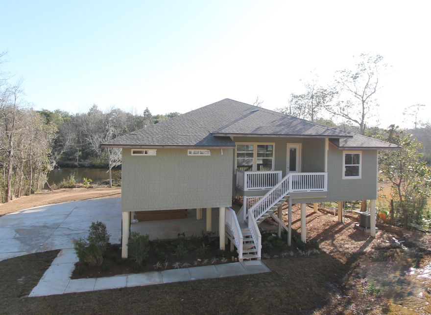 This home is absolutely gorgeous!!!!! Amazing and tranquil views of Gap Creek (with access to Cinco Bayou and the Gulf of Mexico)!!! The kitchen boasts custom cabinetry with crown moulding and plant ledges, 3 CM. Granite countertops, Frigidaire Gallery series stainless appliances {including a commercial grade refrigerator/ freezer),and roomy breakfast bar. The greatroom is located at the rear of the home and opens to a large porch, which is perfect for entertaining. The master suite is located at the left, rear, of the home and has 2 large walk - in closets, double vanities, whirlpool bath with separate shower, and glass enclosure, and a linen closet. Home has a Taexx ,''in the wall'', pest control system that is serviced from the exterior of the home, for owner's convenience. Dock permit application is in process.