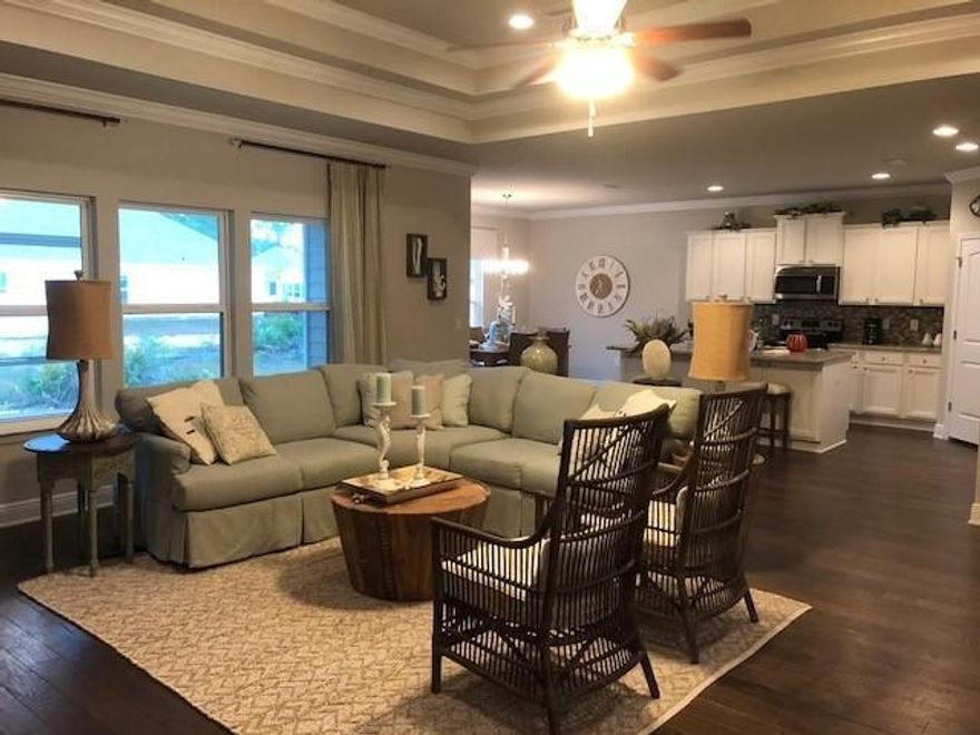 Much anticipated Victoria model home now available for sale on nice corner home site! Beautiful entry leading to bright and very open family room featuring tray ceilings with crown molding and multiple windows make for nice welcome feel the moment you enter. Private hallway leading to master bedroom separate from all guest bedrooms featuring hardwood, and en-suite bathroom. Master bathroom is great size with large walk-in closet, 5ft. tiled shower with bench seat, separate soaking tub and water closet. Beautiful kitchen island with storage on both sides and seating for casual dining or a bright eat-in dining area nicely seating 6. Home site is wooded on a corner lot with extra parking for guests. Eagle Bay Landing is centrally located in Santa Rosa Beach, within a short drive to 30-A,